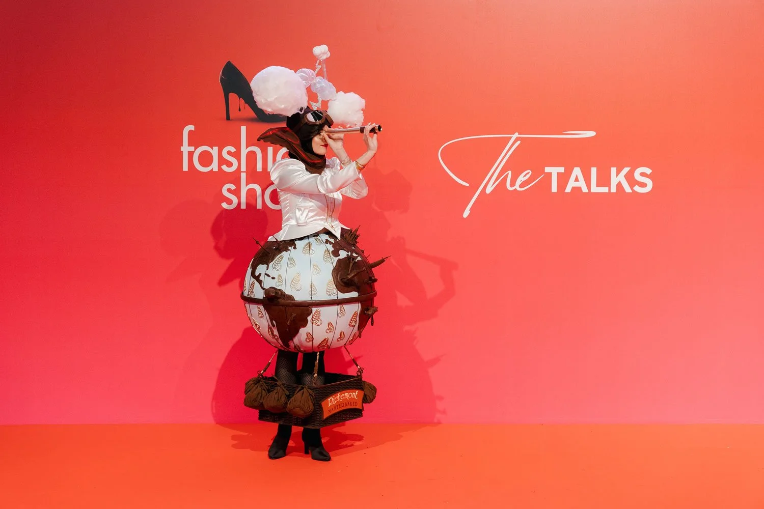 Fashion industry stage installation and branded display during a fashion show event.