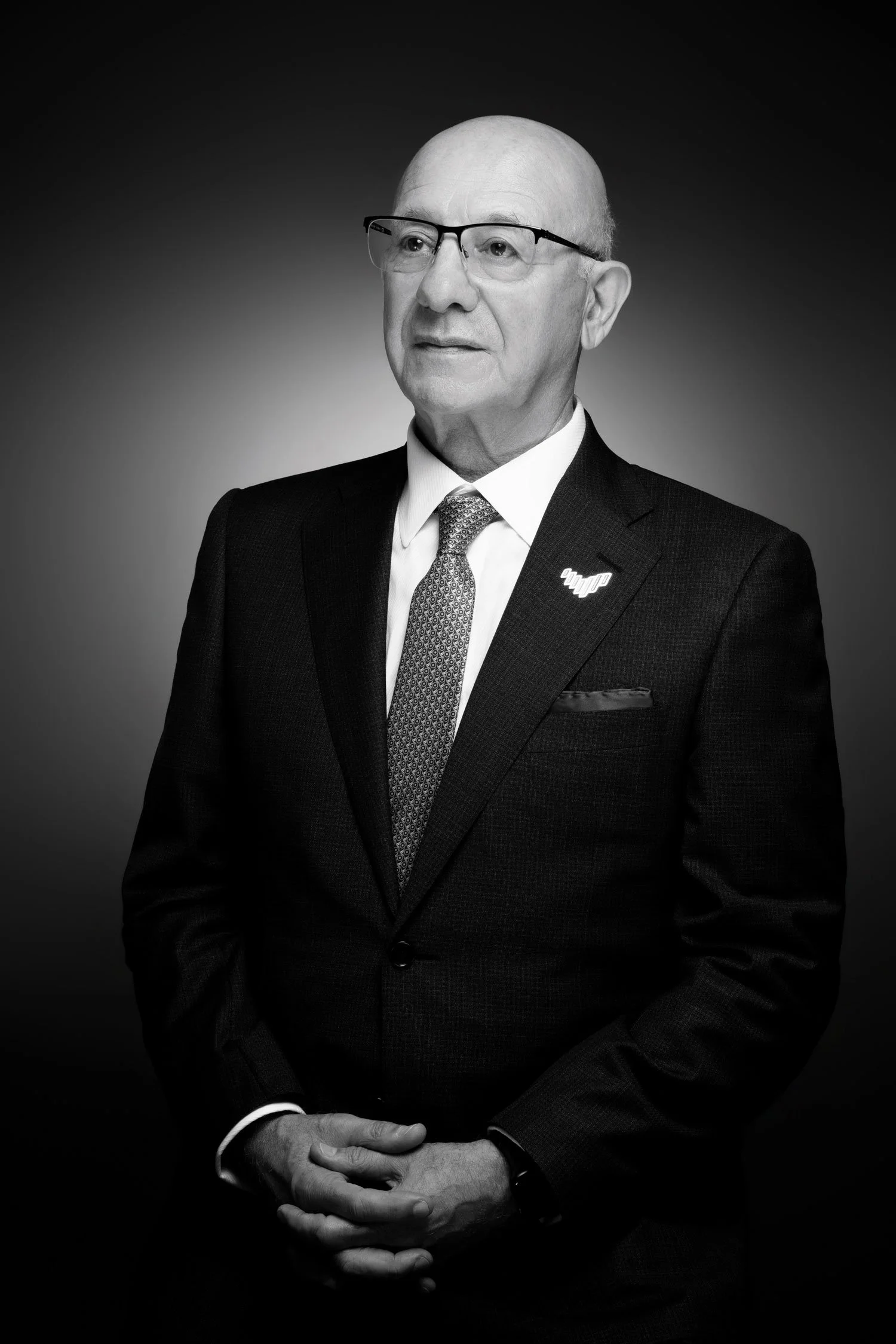 Business leader portrait photographed in natural office environment for corporate profile photography in Dubai.