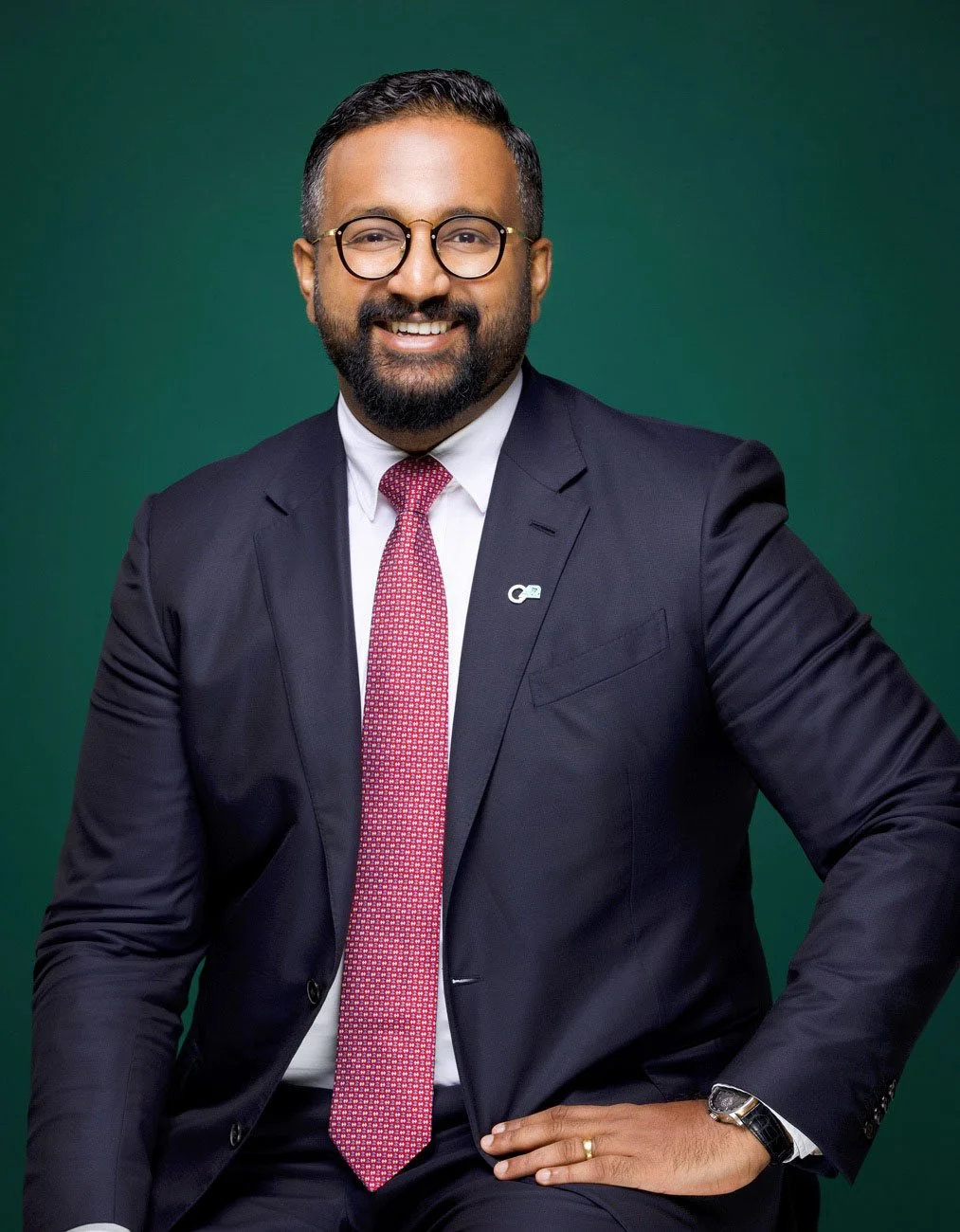 Business leader portrait photographed in natural office environment for corporate profile photography in Abu Dhabi.