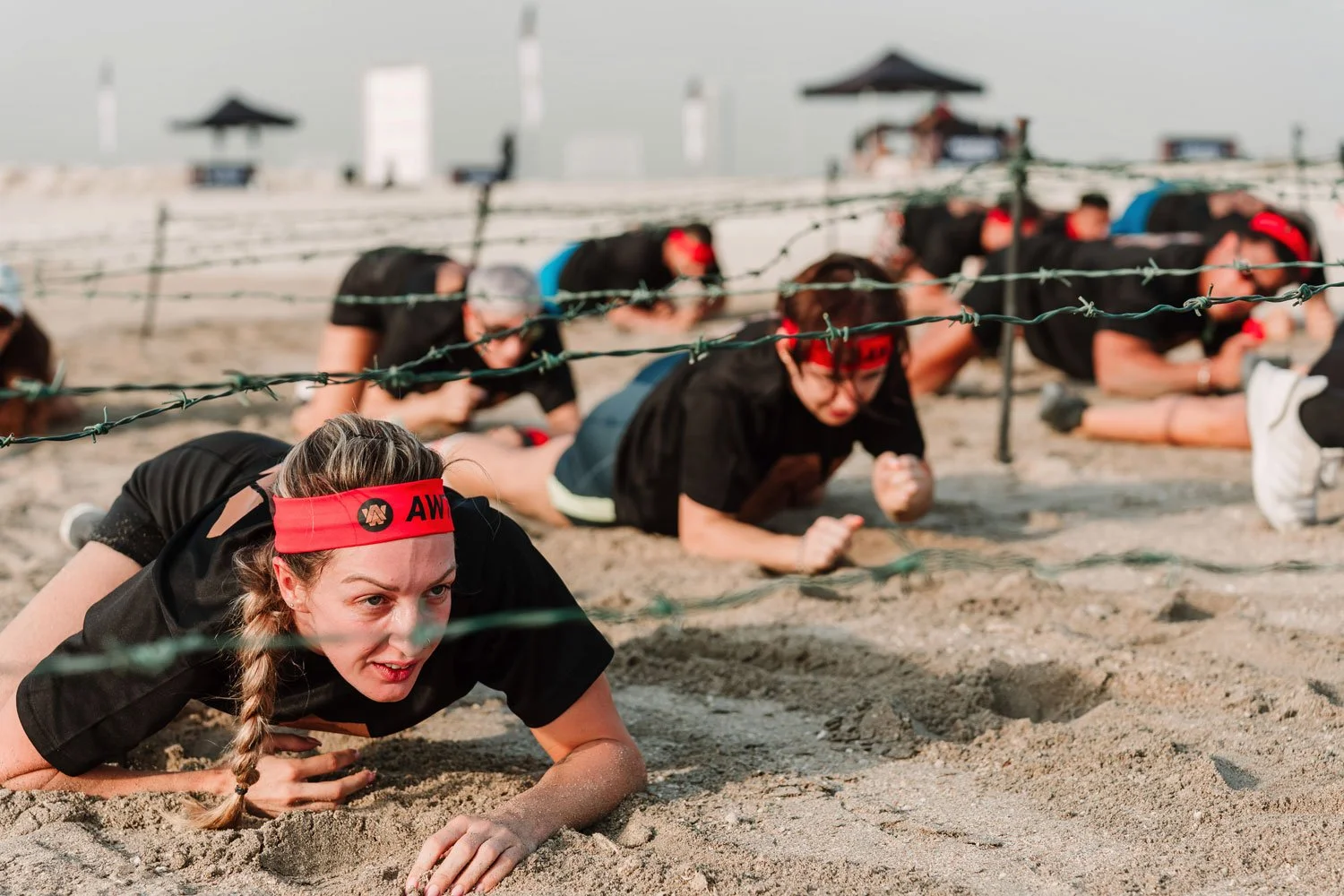 Participants competing in an outdoor endurance obstacle race event.