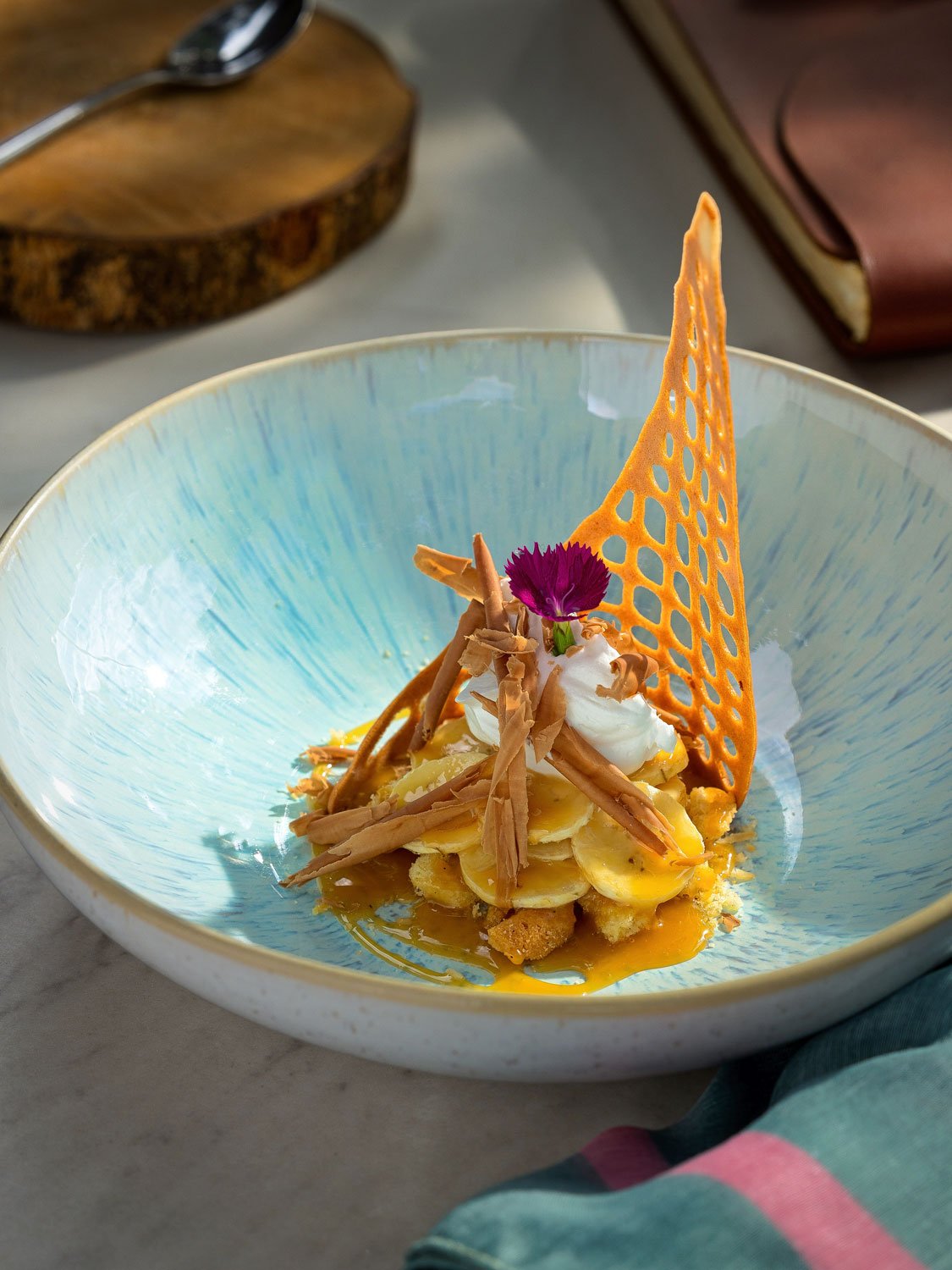 Food photography for hospitality, showcasing a plated dish in a restaurant setting