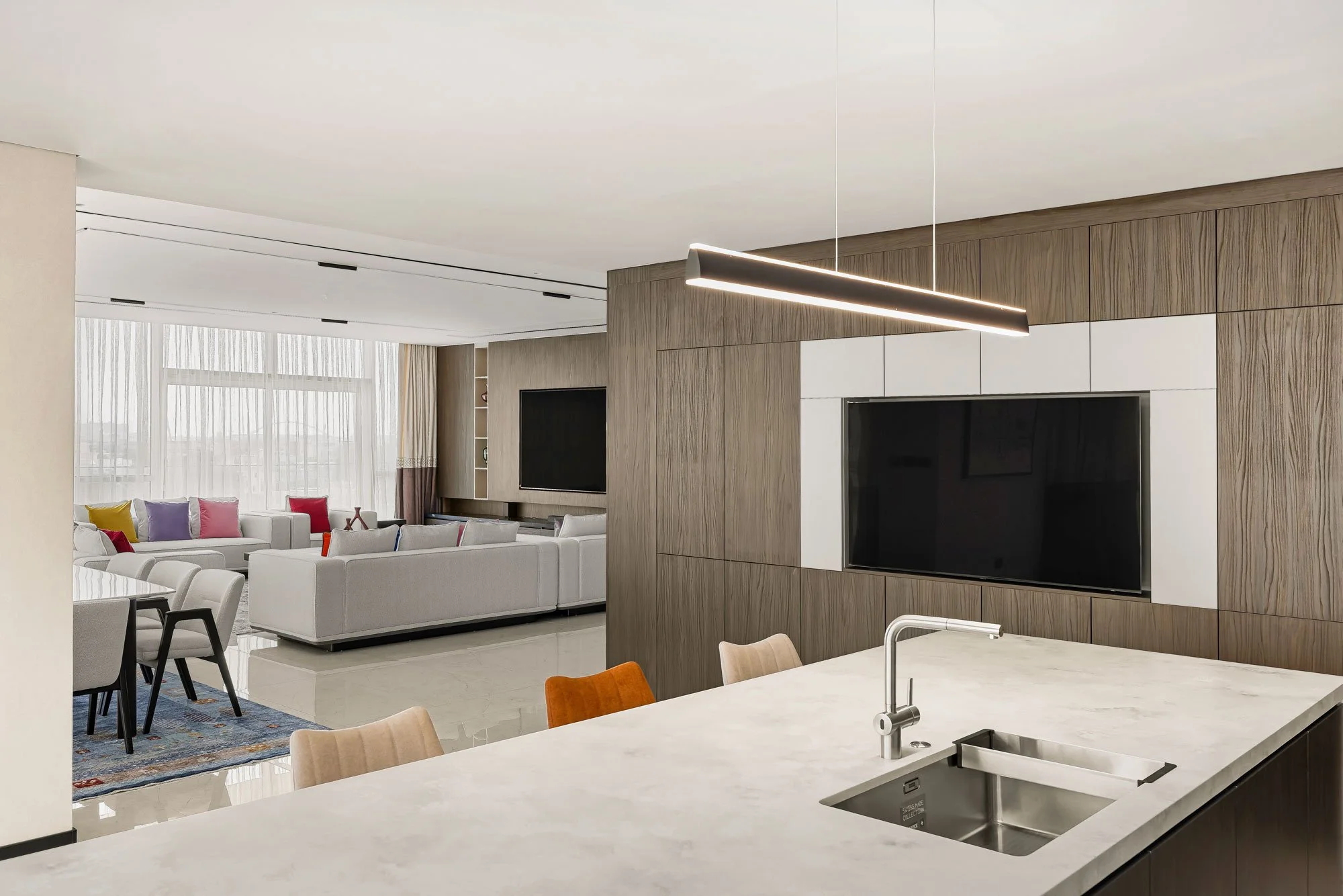 Interior design photography showcasing modern kitchen and open-plan living space