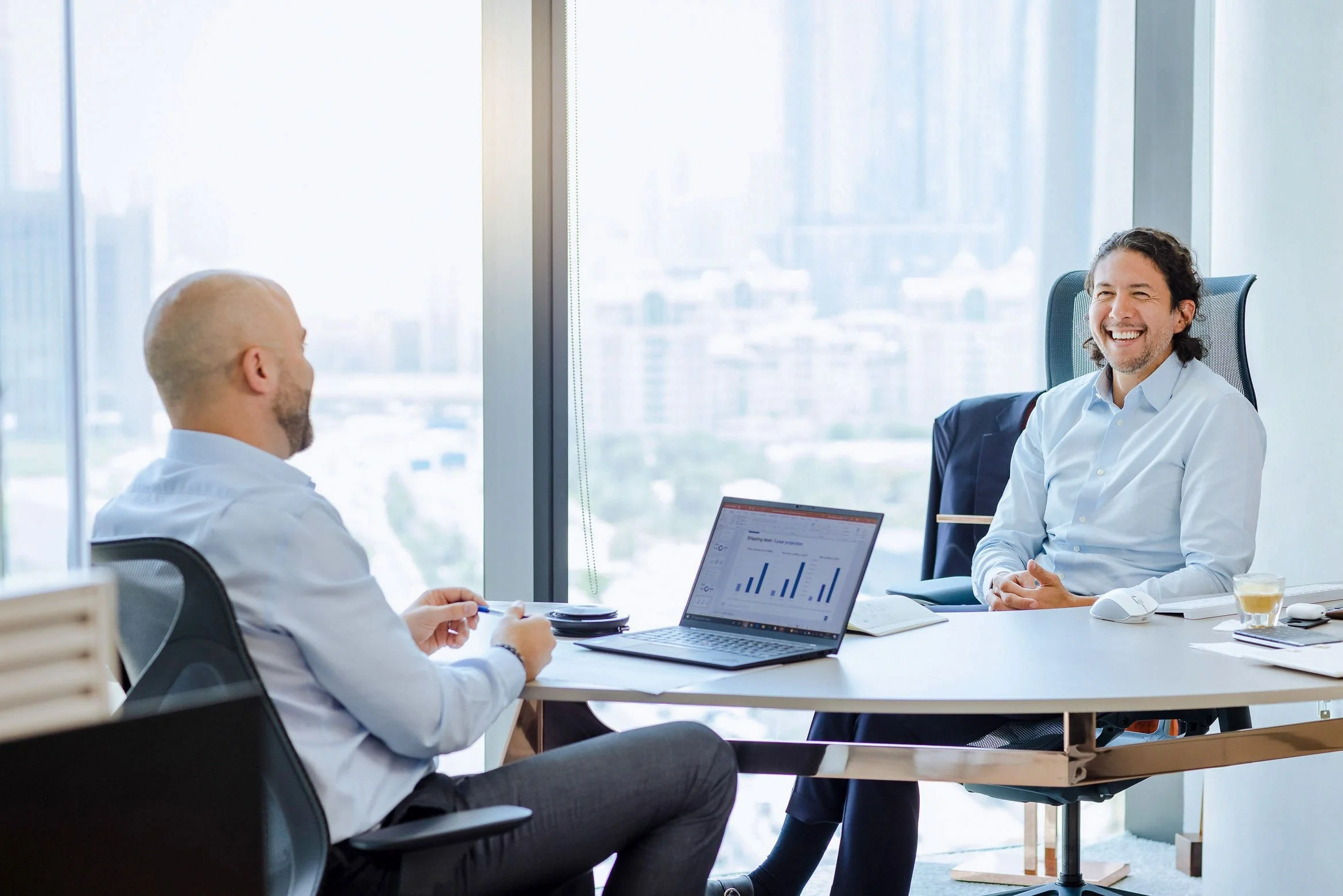 Business professionals collaborating in modern office environment captured for corporate lifestyle photography.