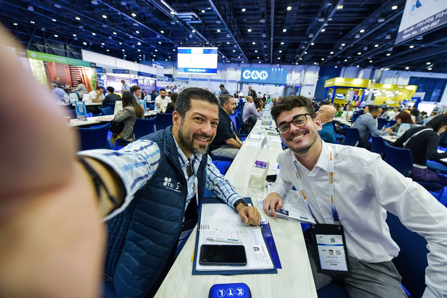 Corporate networking reception during international exhibition event.