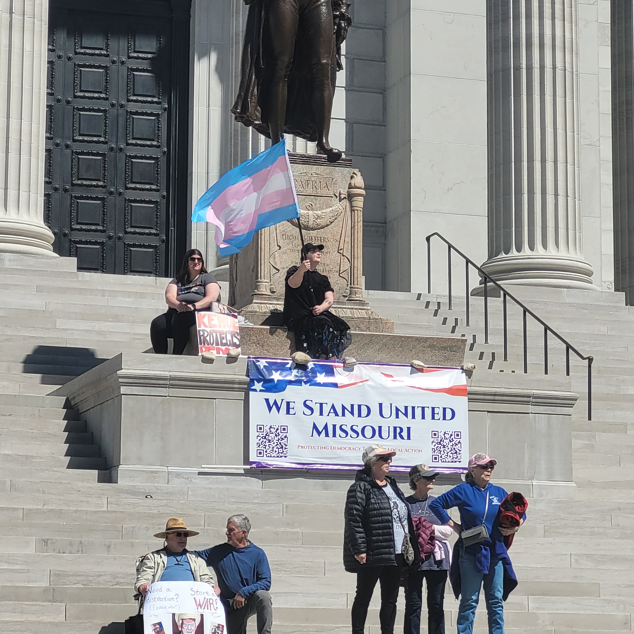 IN•TACT Advocates waving Trans Flags on the Missouri Capitol Steps at No Kings III