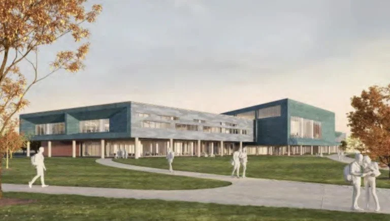 Architectural rendering of a modern, multi-story building with large windows, surrounded by a green lawn, trees, and people walking.