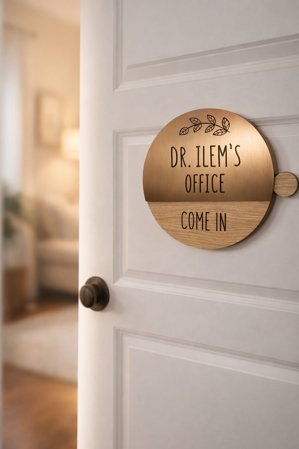 A circular wooden and metal sign on a white door reads "Dr. Ilem's Office Come In" with a leaf design at the top. The door is open to a counseling office that looks calm.
