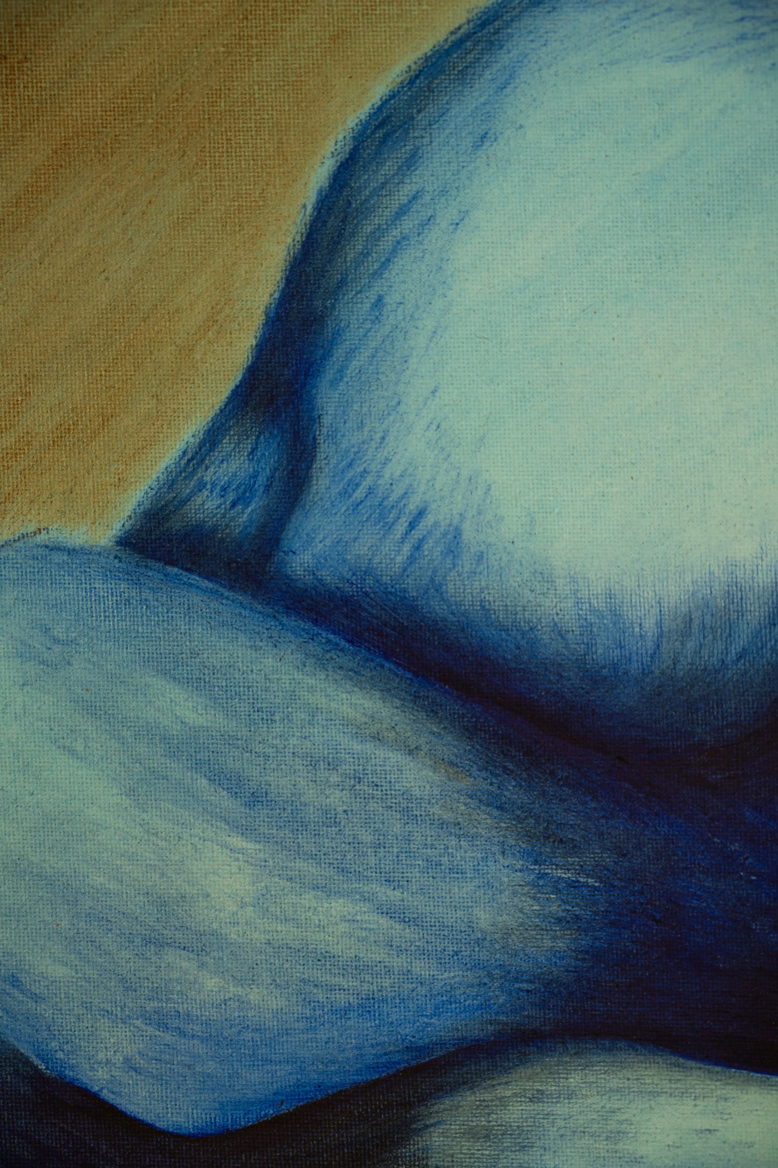 Close-up of a ballpoint pen drawing of a blue and beige abstract shape with textured shading.
