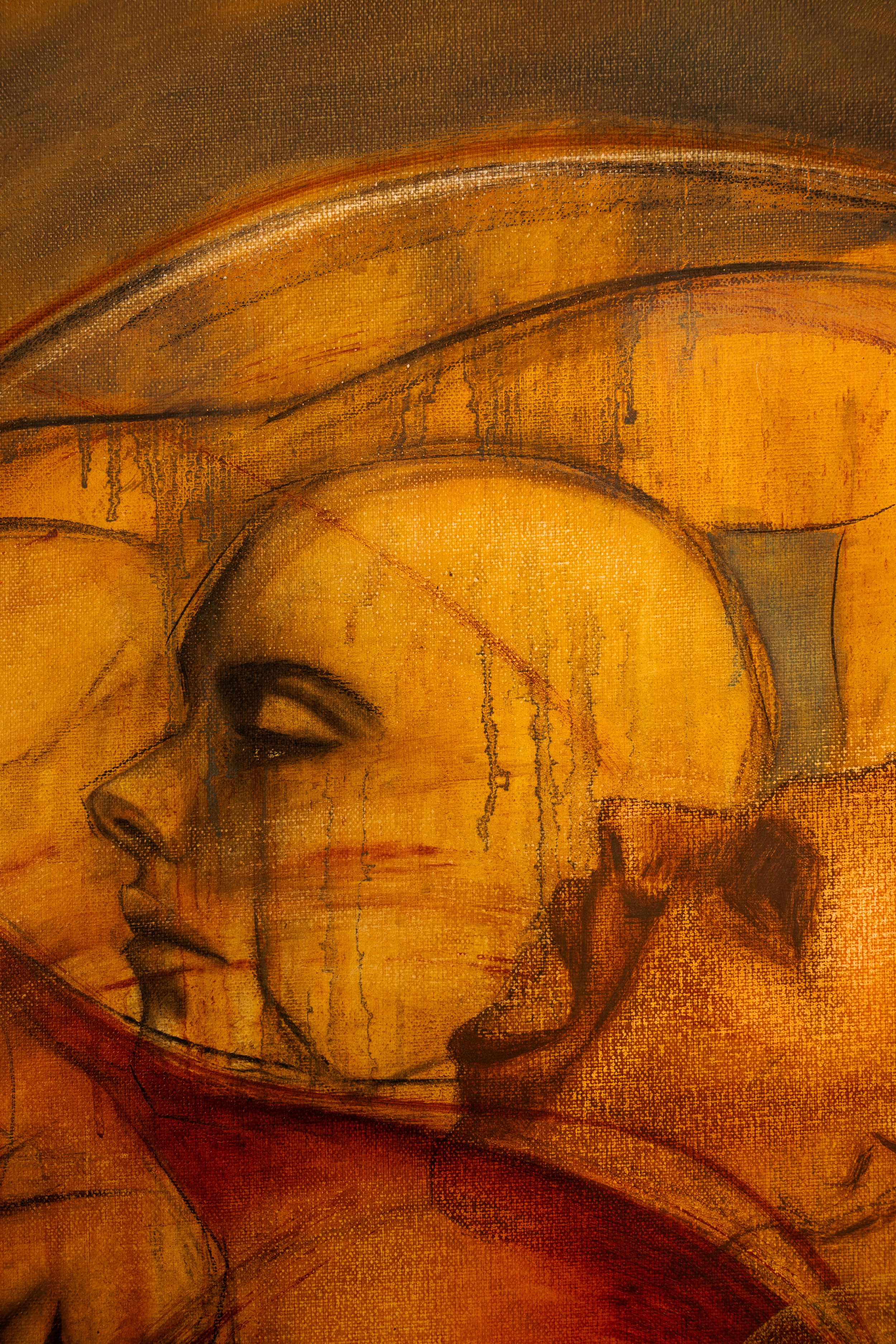 Abstract artwork featuring a profile of a person's face with closed eyes, rendered in warm tones of yellow, orange, and brown with textured, layered brushstrokes.