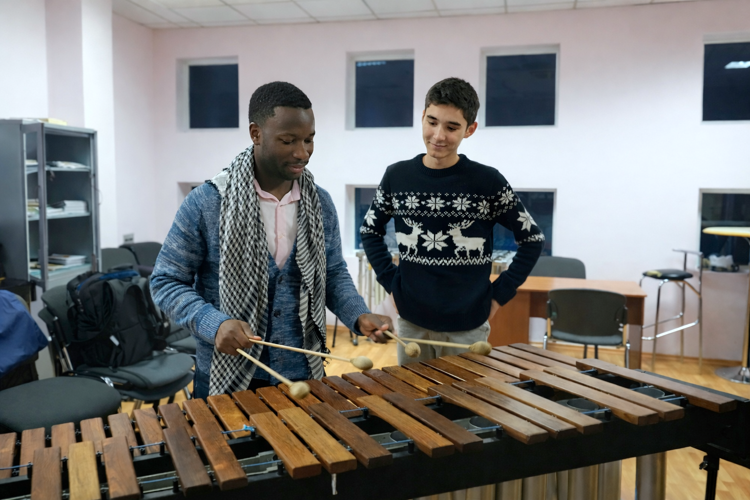 Quincy teaching marimbas to a student