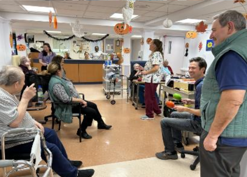 a group of people smiling in a hospital waiting room
