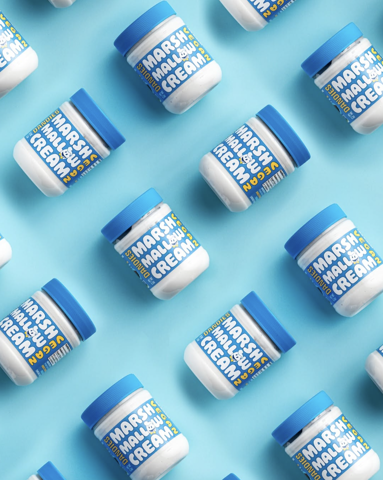 Dandie's marshmallow cream jars on a blue background