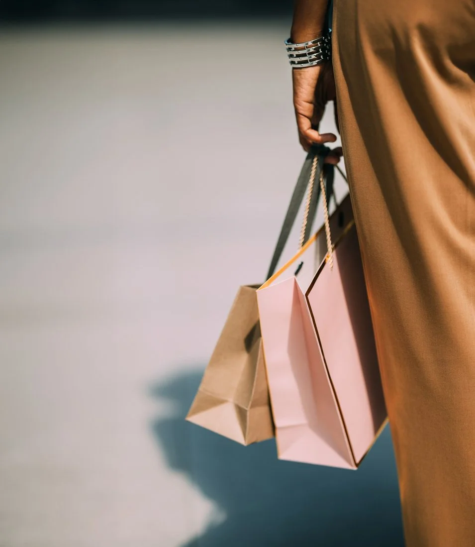 Female carrying shopping bags