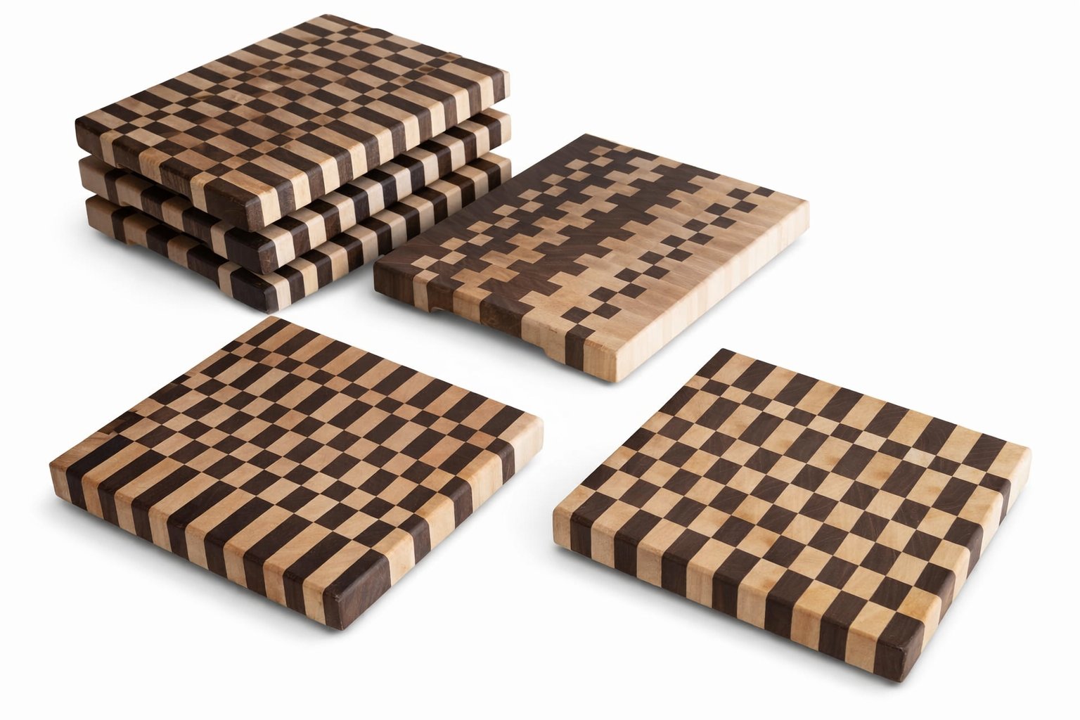 A set of maple & Walnut End Grain cutting boards, some stacked and some laid flat on a white background.