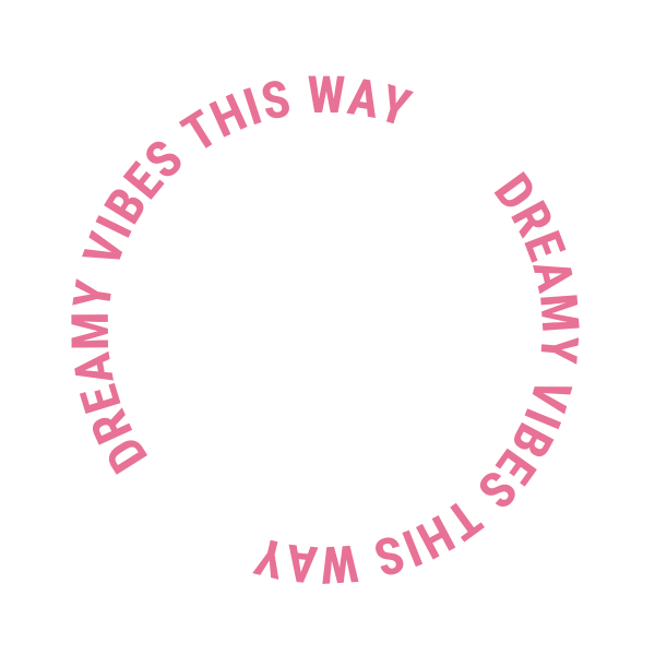 A circular black background with pink text that says, "DREAMY VIBES THIS WAY" repeated in a circle.
