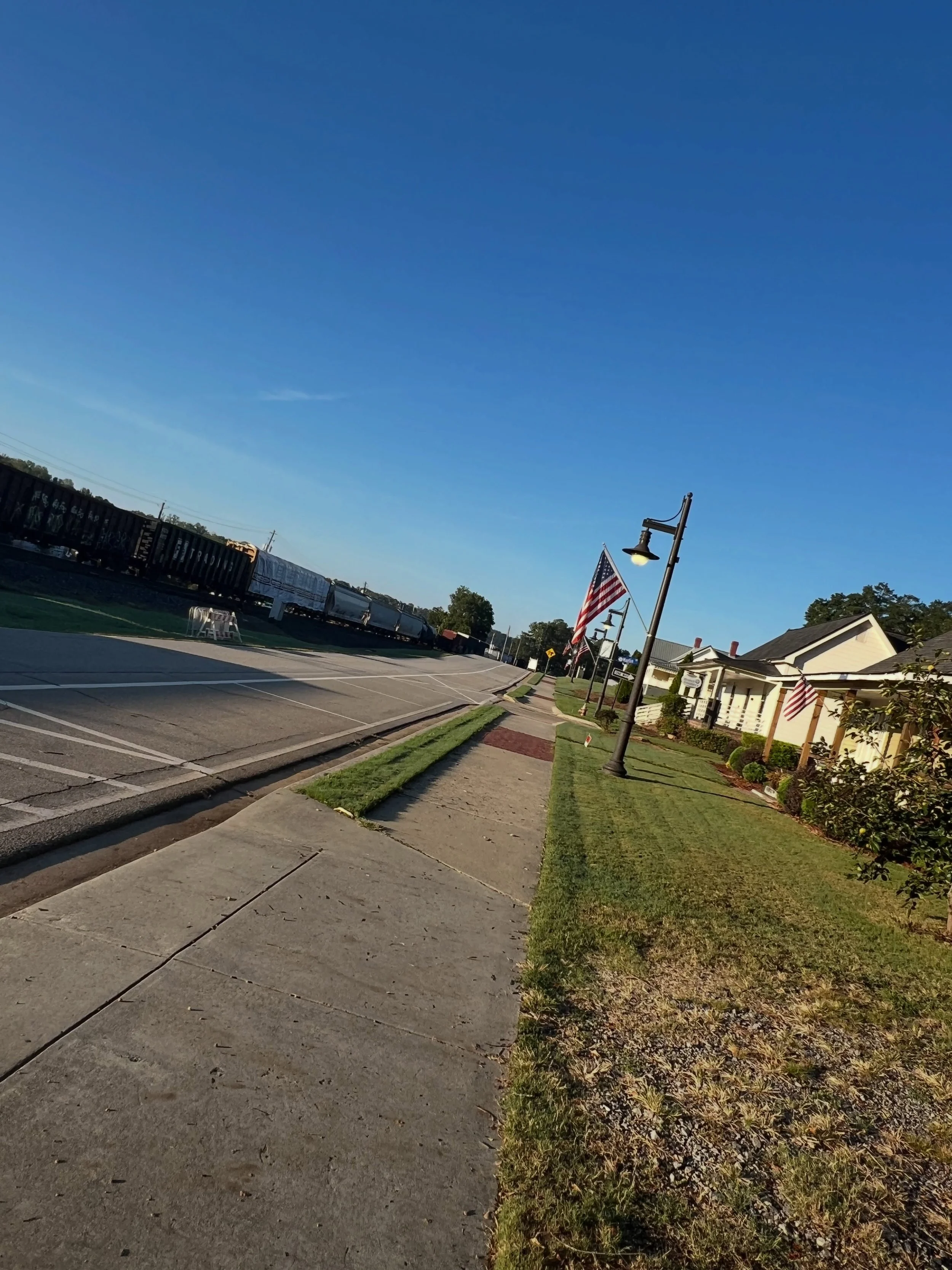 As I was walking, praying, and listening, I thought about how much I love this town and living near the train tracks. 
It&rsquo;s pure Americana. 
Expansion. Progress. Wanderlust. 

Less than a minute later, I heard the familiar horn and rumble.  Whi