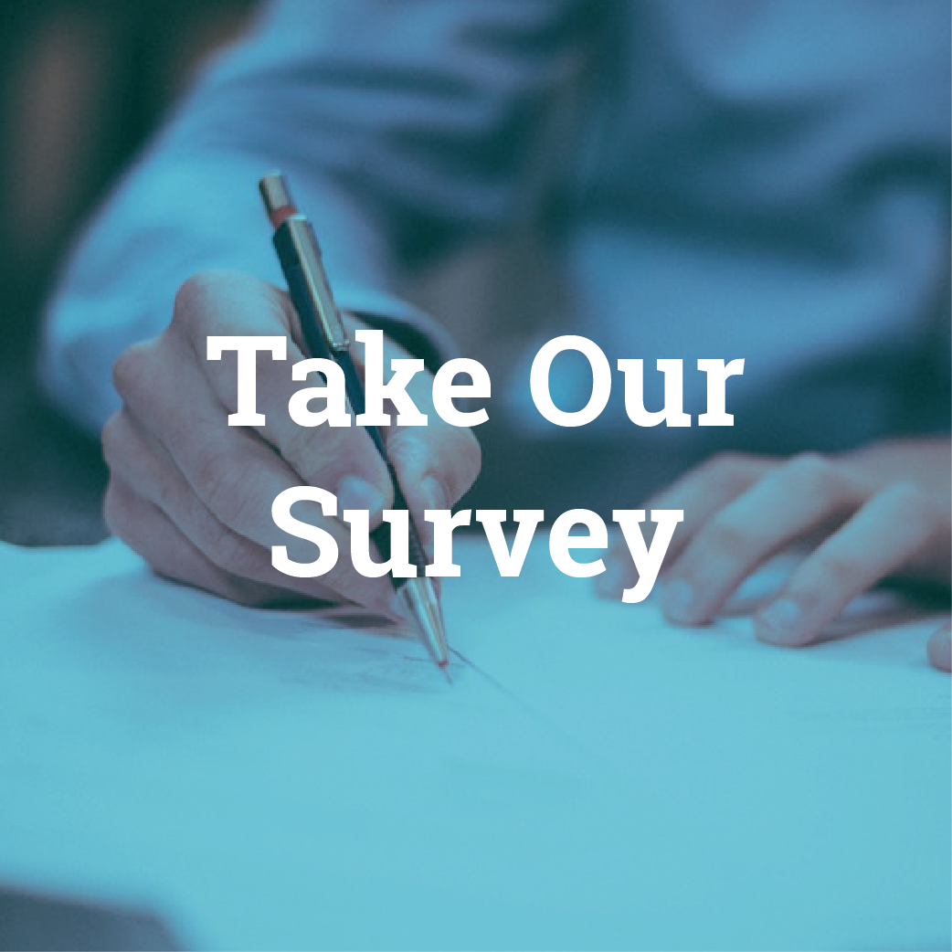 Close-up of a person writing with a pen on paper with the text 'Take Our Survey' overlayed.