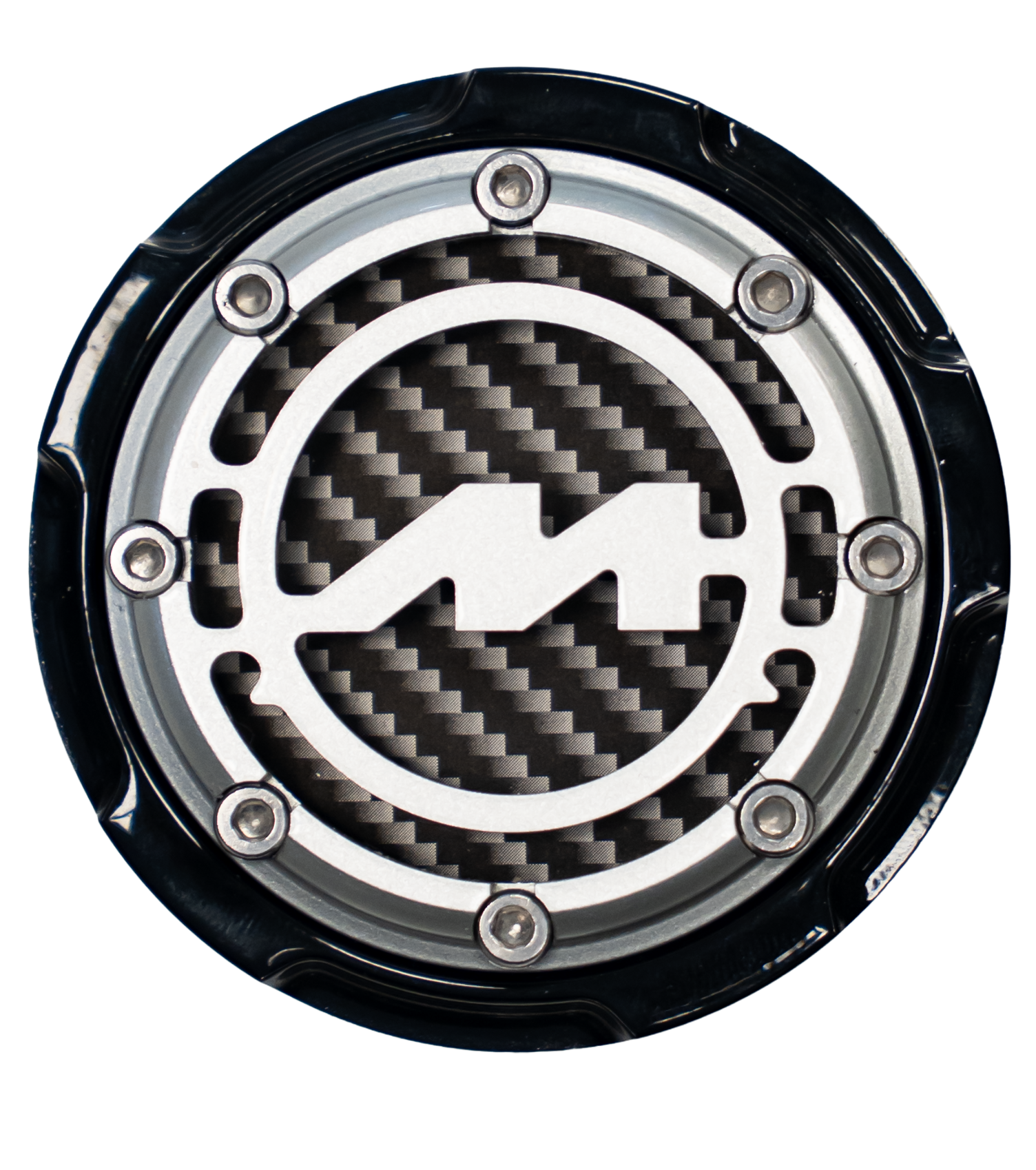 Close-up of a circular yacht emblem with a carbon fiber background and metal border, featuring a stylized lightning bolt in the center.