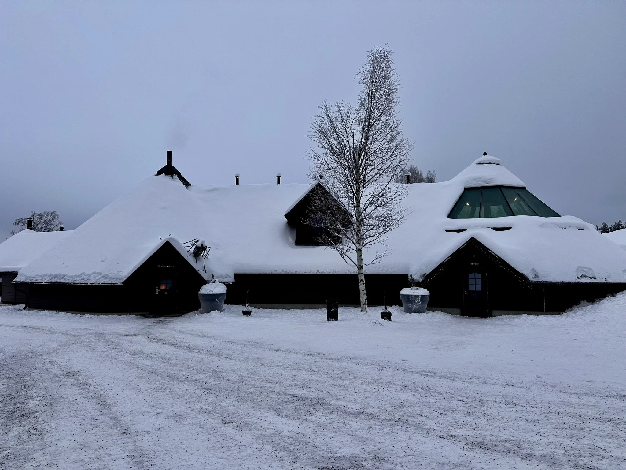 Arctic SnowHotel Kota Restaurant  building under heavy snow in Finnish Lapland - winter travel conditions to expect