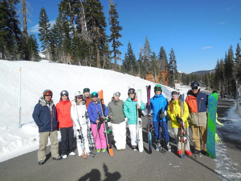 Group of ten people dressed in ski gear