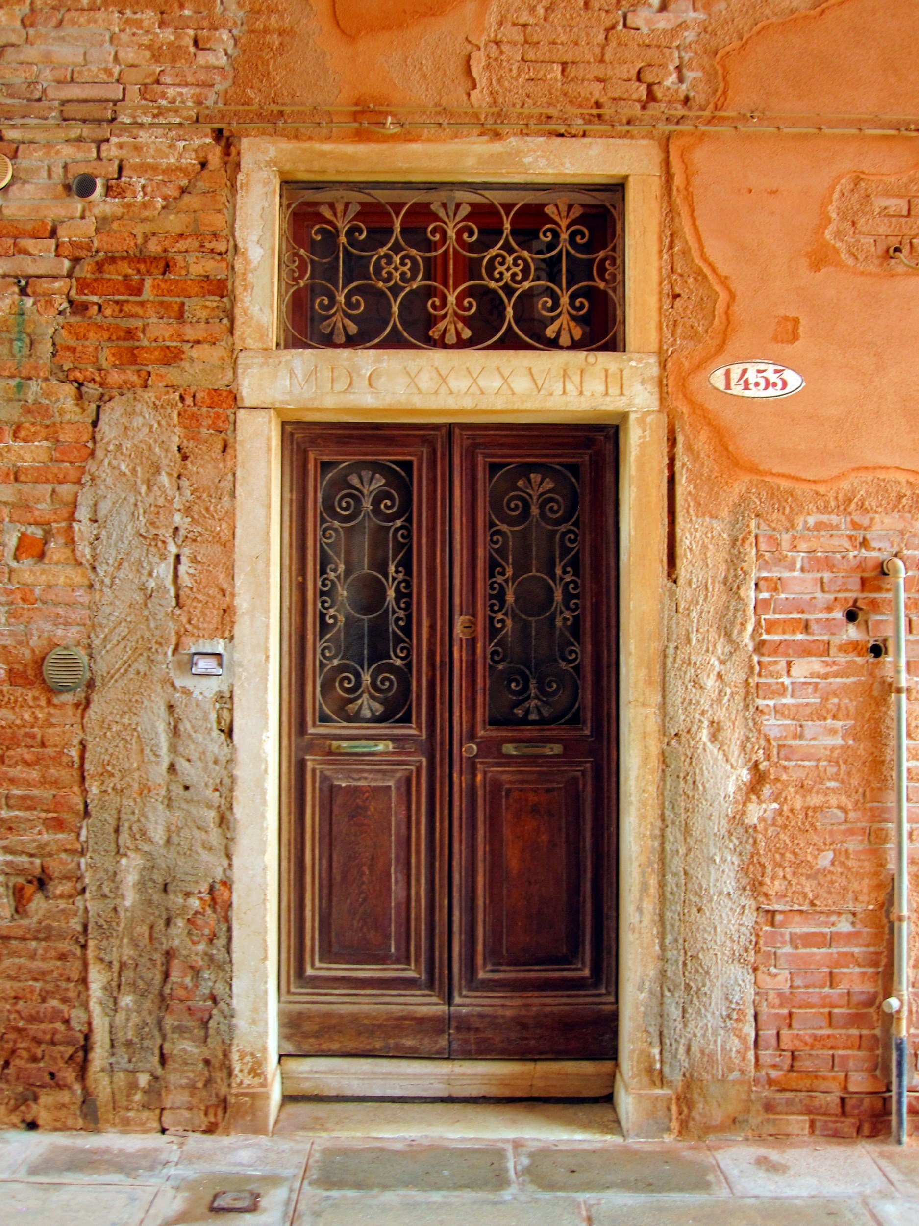 wooden doors in brick building