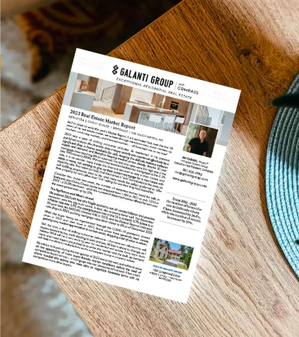 Real estate market report flyer from Galanti Group on a wooden table, featuring images of a home interior and exterior, and a photo of a man in a black shirt.