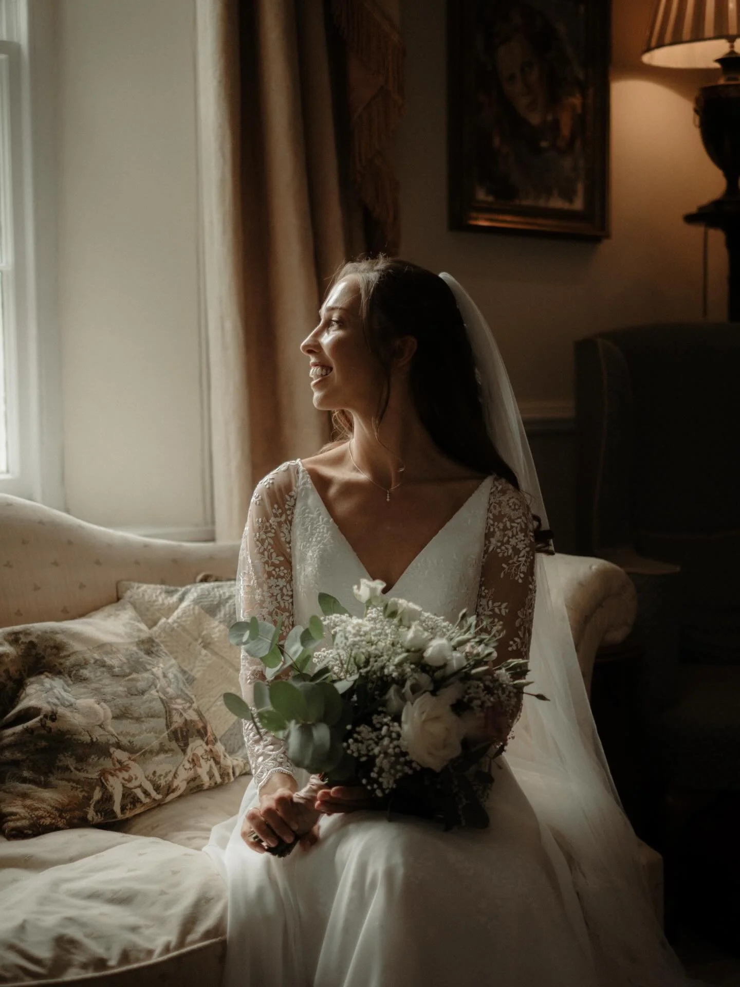 Stunning Lily in the drawing room at Woodhayne Barton, just before leaving for her ceremony. 

While the house remains private, the drawing room is available to hire on the morning of your wedding, whether as a space to gather and get ready, or for a