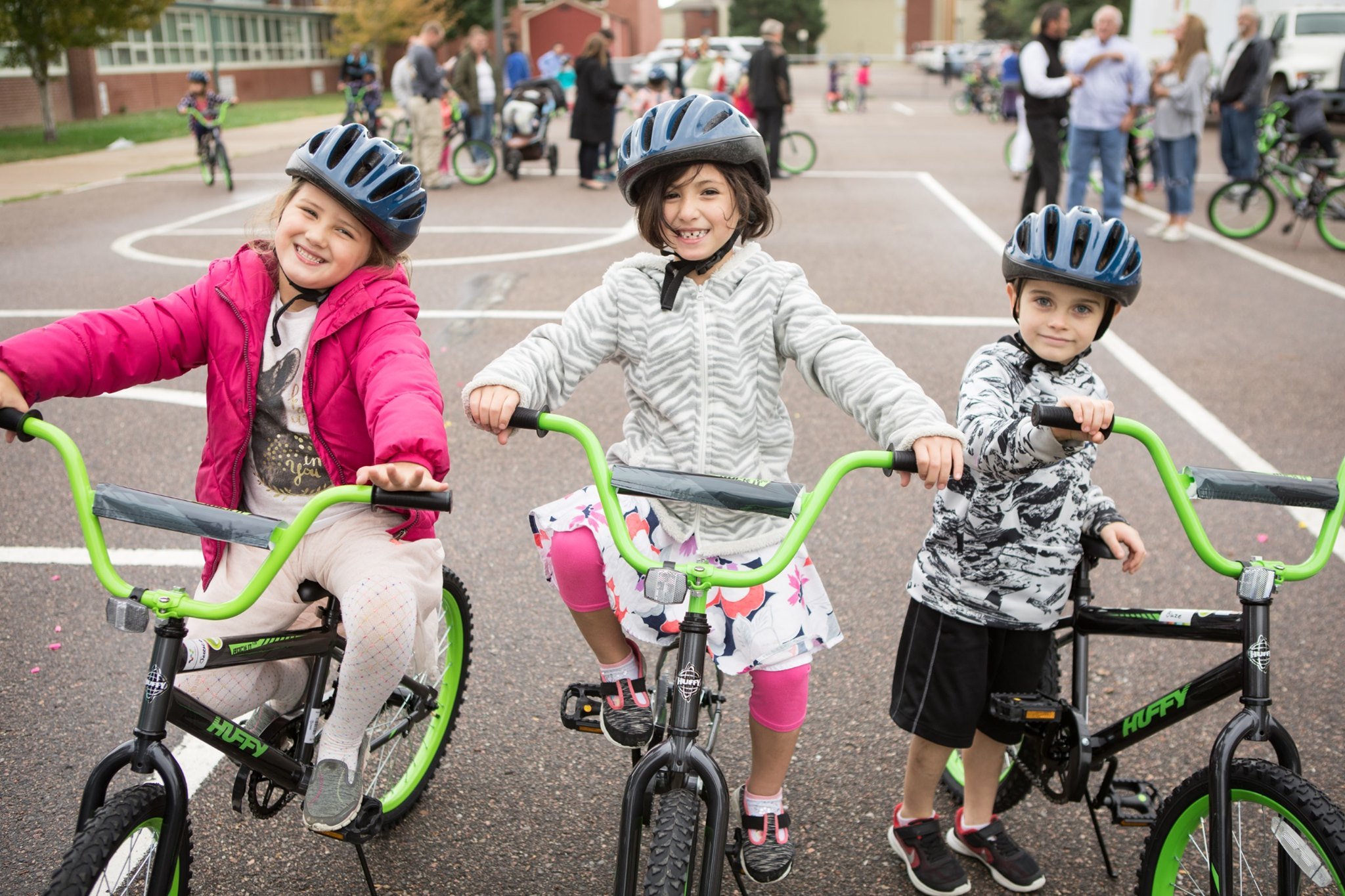 Children receiving their bikes from Wish for Wheels non-profit organization.
