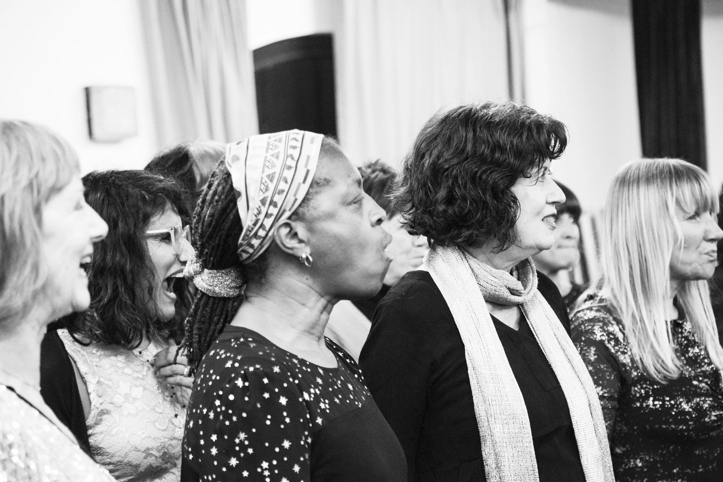 A joyful, high-energy warm-up with Soul of the City Choir members just moments before their performance.