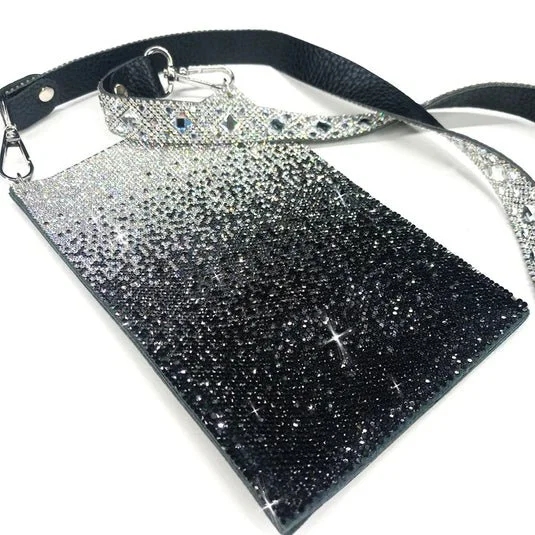 A black and silver glitter handbag with a matching strap.
