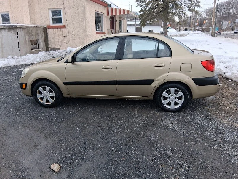 06 kia full side.jpg