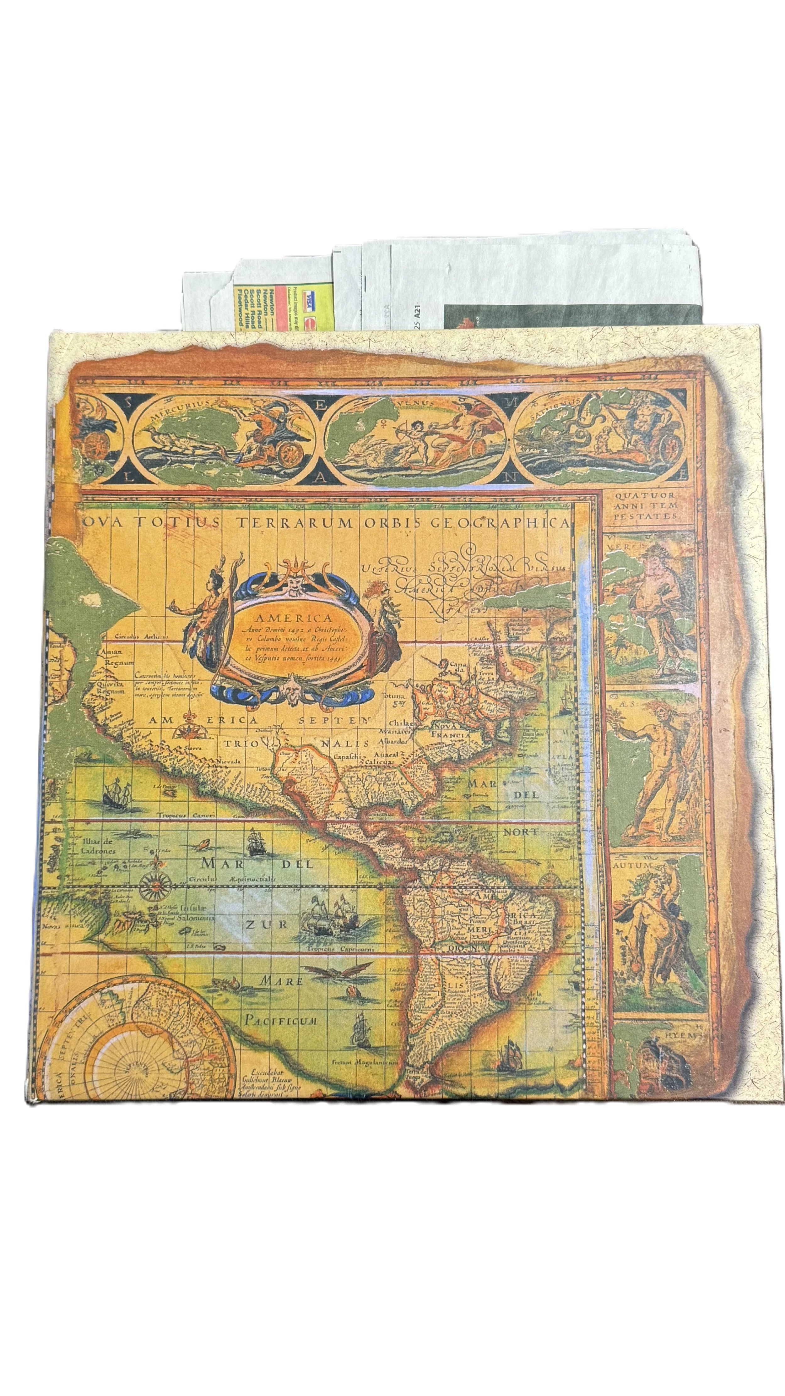 A vintage map of the Americas with ornate decorations and Latin labels, showing North and South America, with part of Europe and Africa visible at the top.