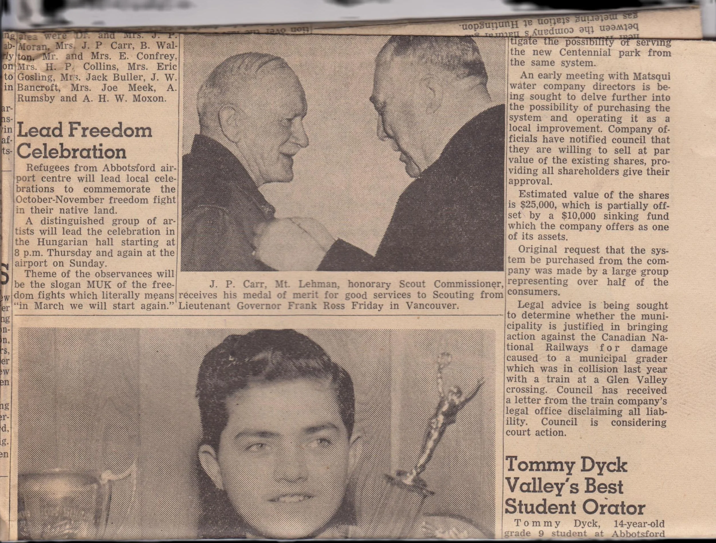 Percy Carr of Mt. Lehman, honorary Scout Commissioner, receives his medal of merit for good services to Scouting from Lieutenant Governor Frank Ross Friday in Vancouver."