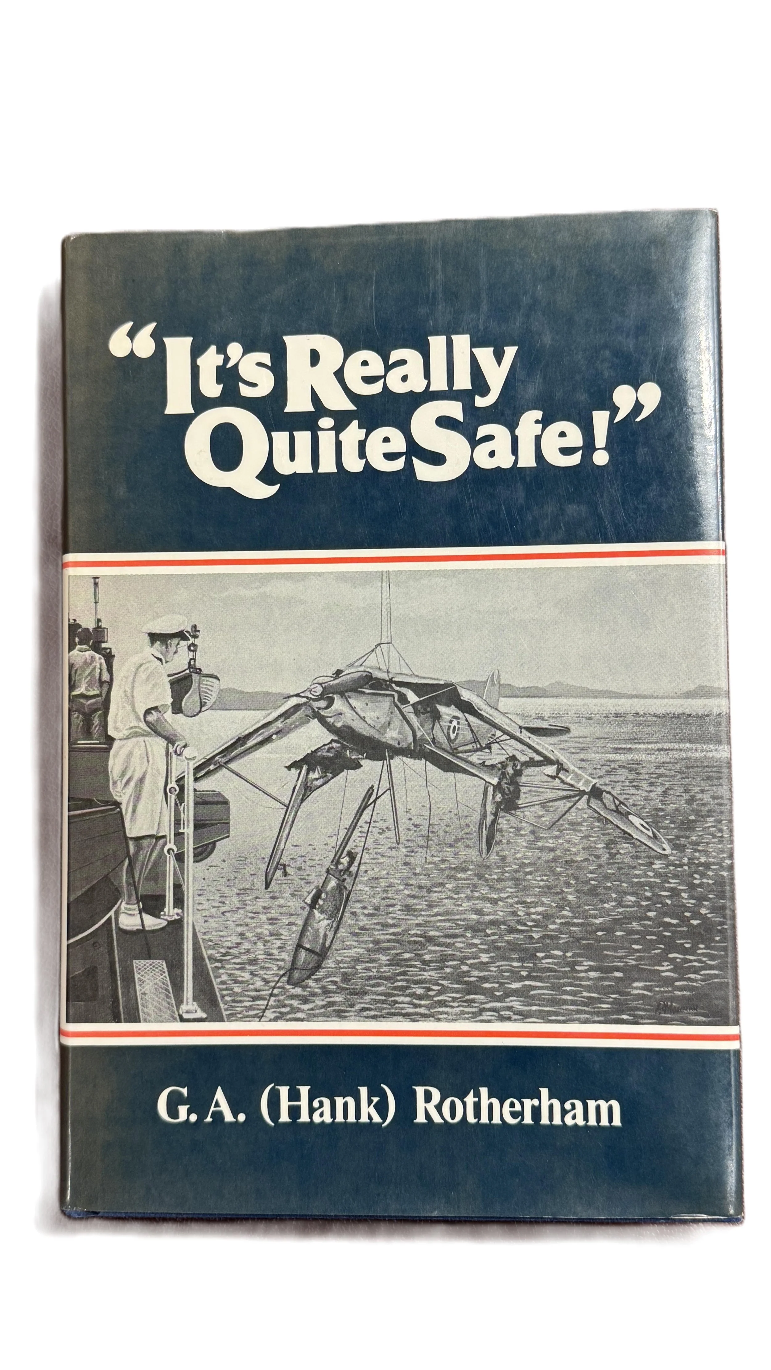 Book cover titled "It's Really Quite Safe!" by G. A. (Hank) Rotherham, featuring an illustration of a large lobster being lowered into the water from a boat, with a person in a white outfit and a hat standing on the boat's deck.