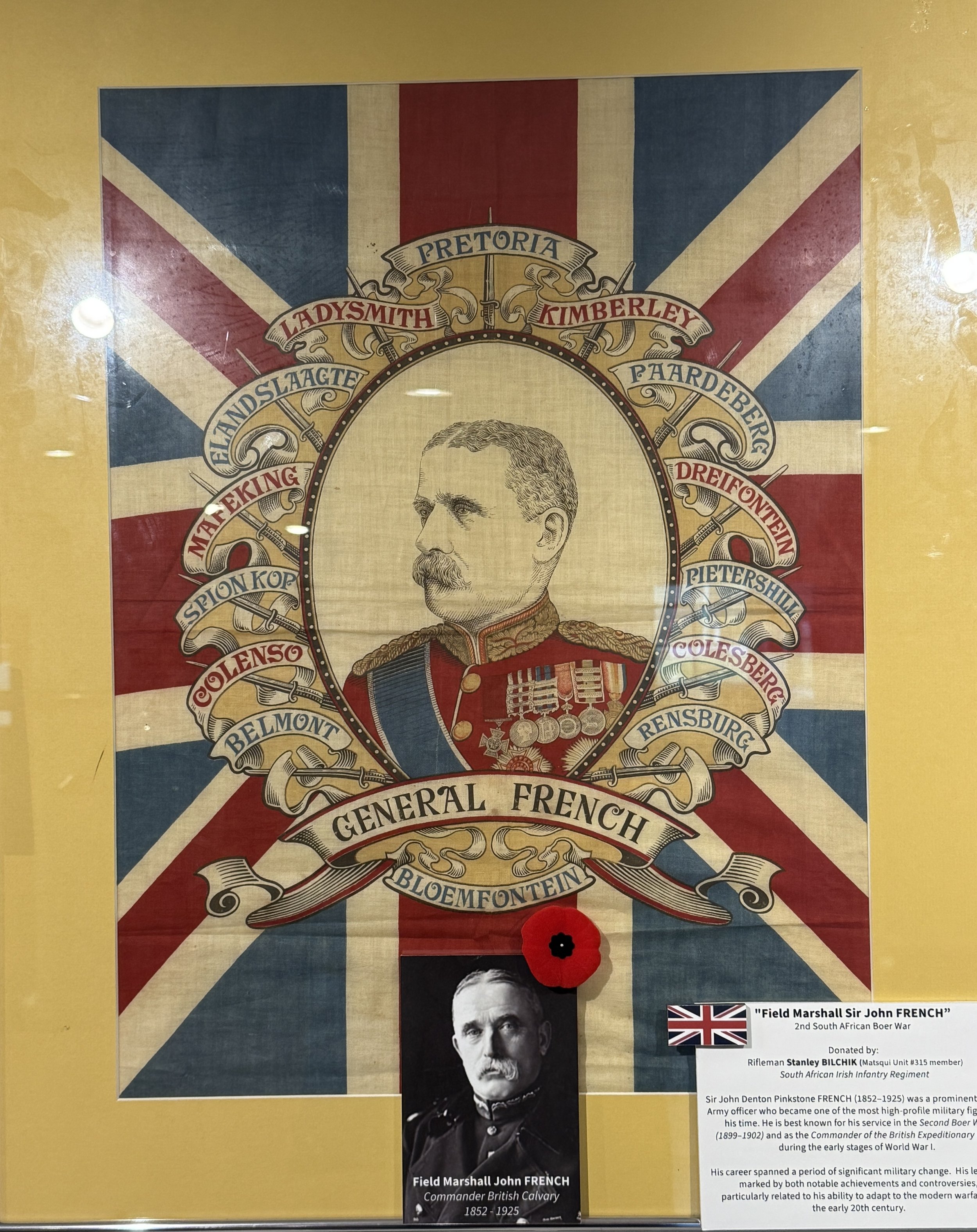A collage featuring a portrait of Field Marshal Sir John French, with a background of the Union Jack. The collage includes a photo of French, his name, military rank, and description, along with a red poppy and details of his service during the Secon