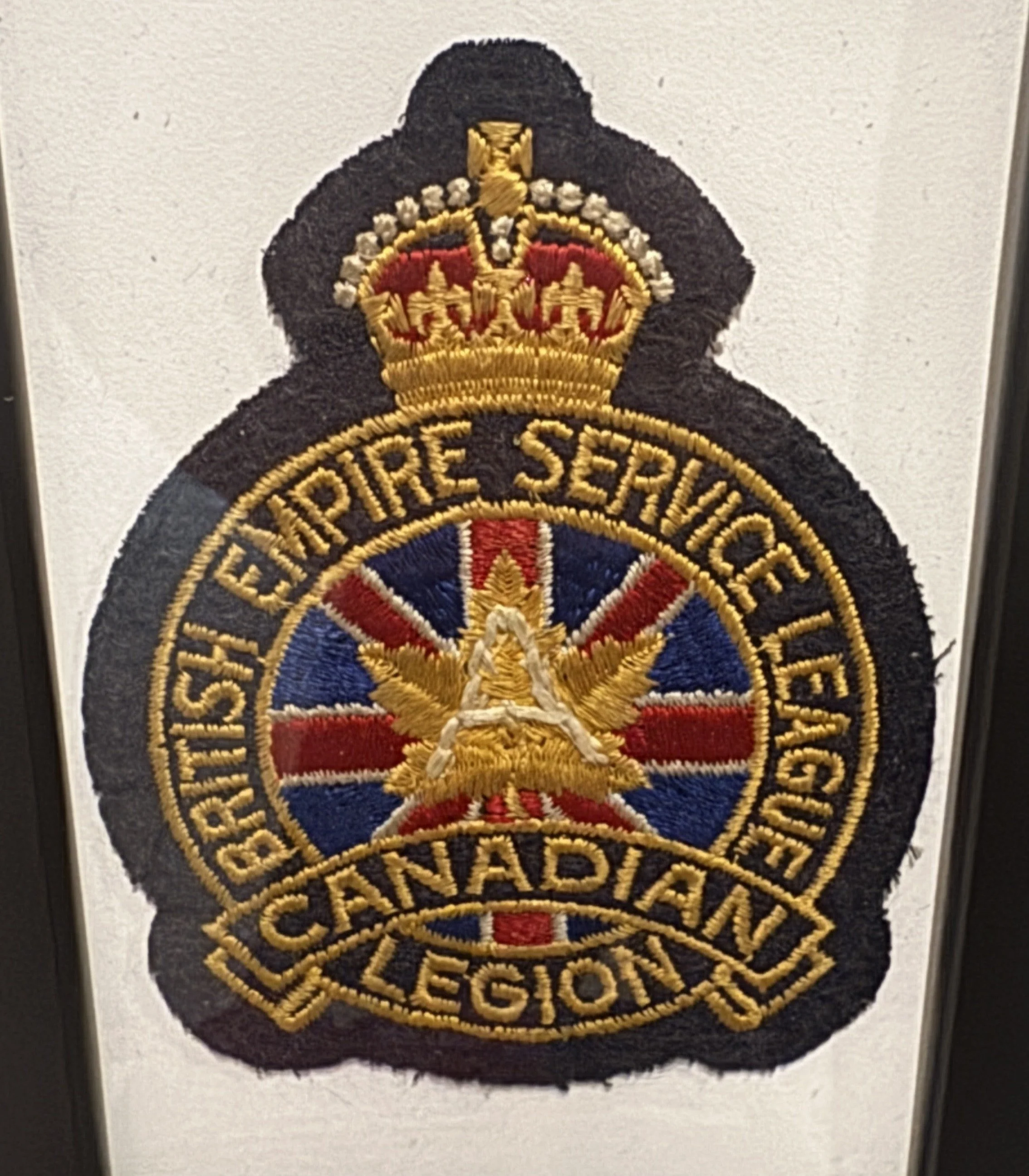 Embroidered patch of the Royal Canadian Mounted Police, featuring a crown, a star, and the text "EMPIRE SERVICE VEHICLE" and "ROYAL CANADIAN REGIONS."