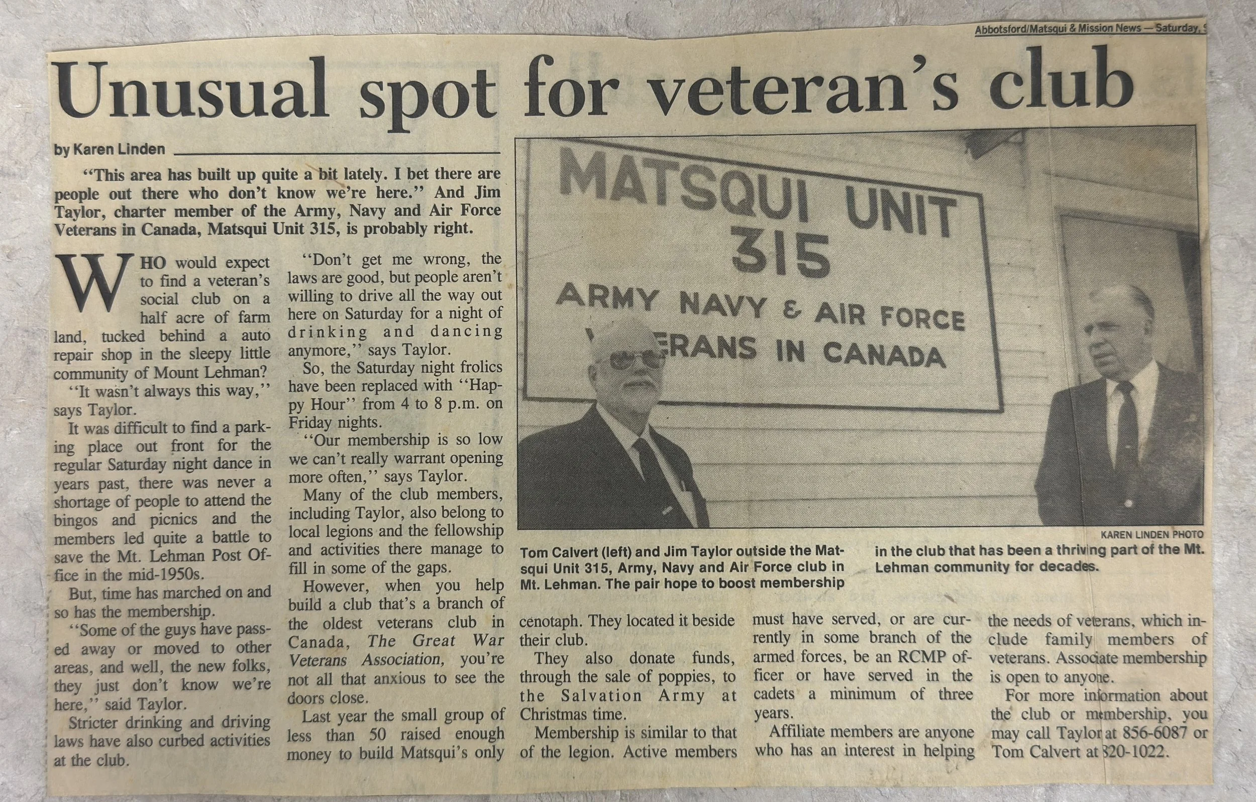 A newspaper article titled 'Unusual spot for veteran's club'. The article discusses the local medieval club of army, navy, and air force veterans in Mount Lehman, Canada, and features a photo of Tom Calvert and Jim Taylor standing outside a sign that