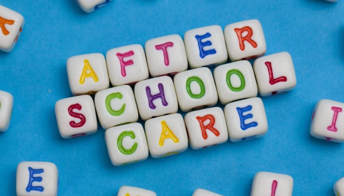 Colorful letter beads spelling 'AFTER SCHOOL CARE' on a blue background.