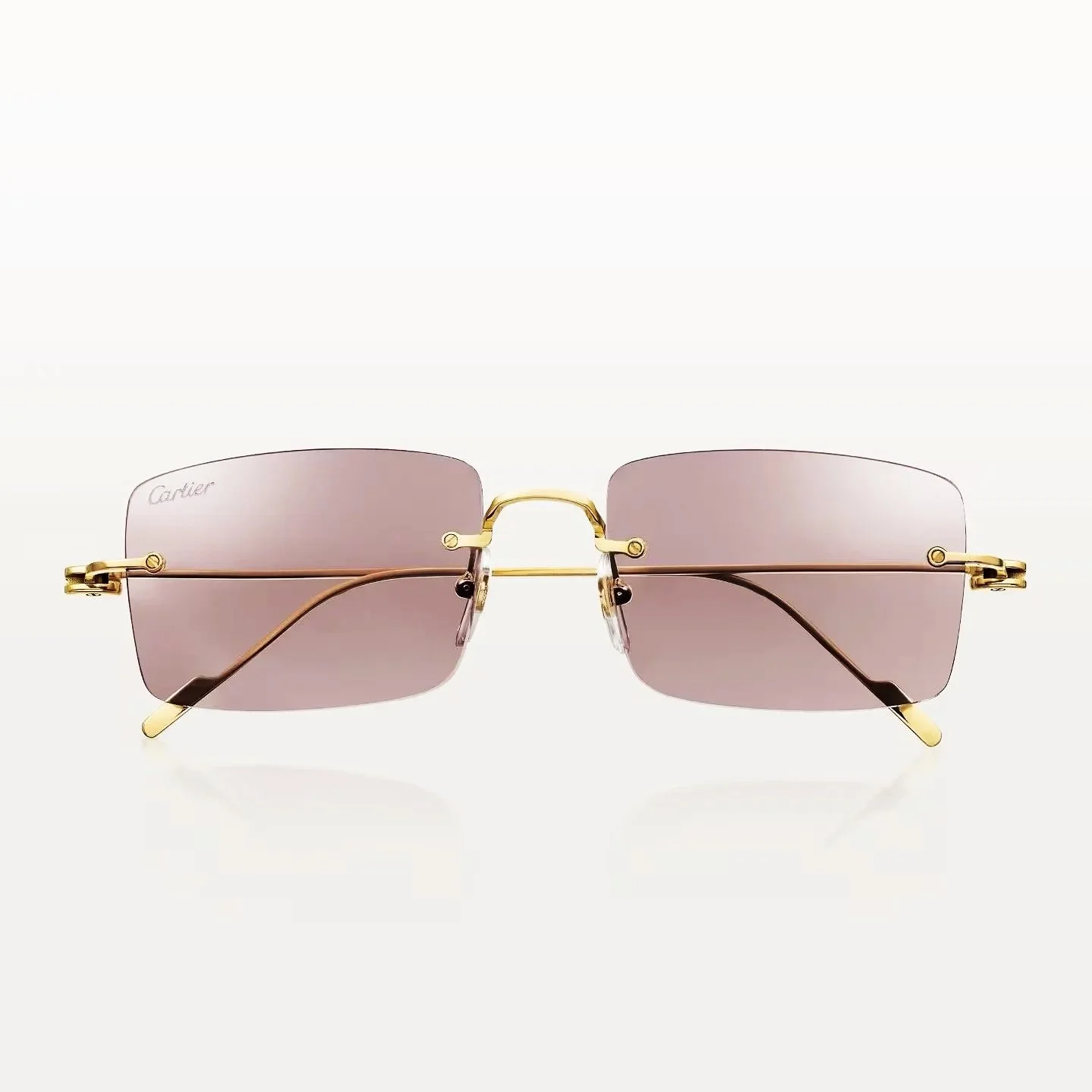 Lunettes de soleil de luxe avec monture en or et verres rose, marqué Cartier.