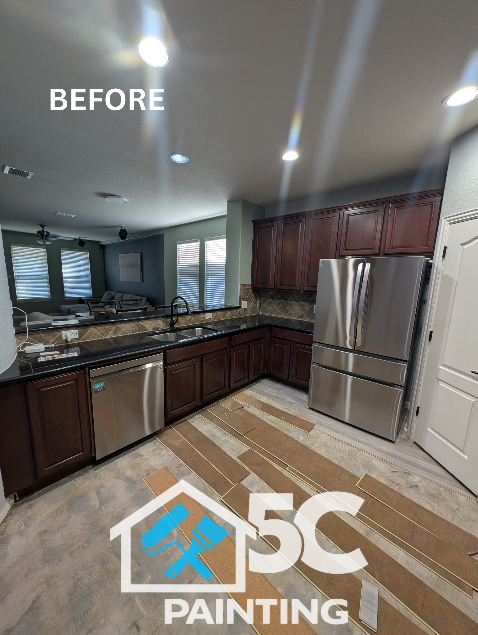 A wider before shot showing the original cherry cabinetry throughout this Lake Dallas kitchen — the starting point for a full slate blue cabinet transformation.
