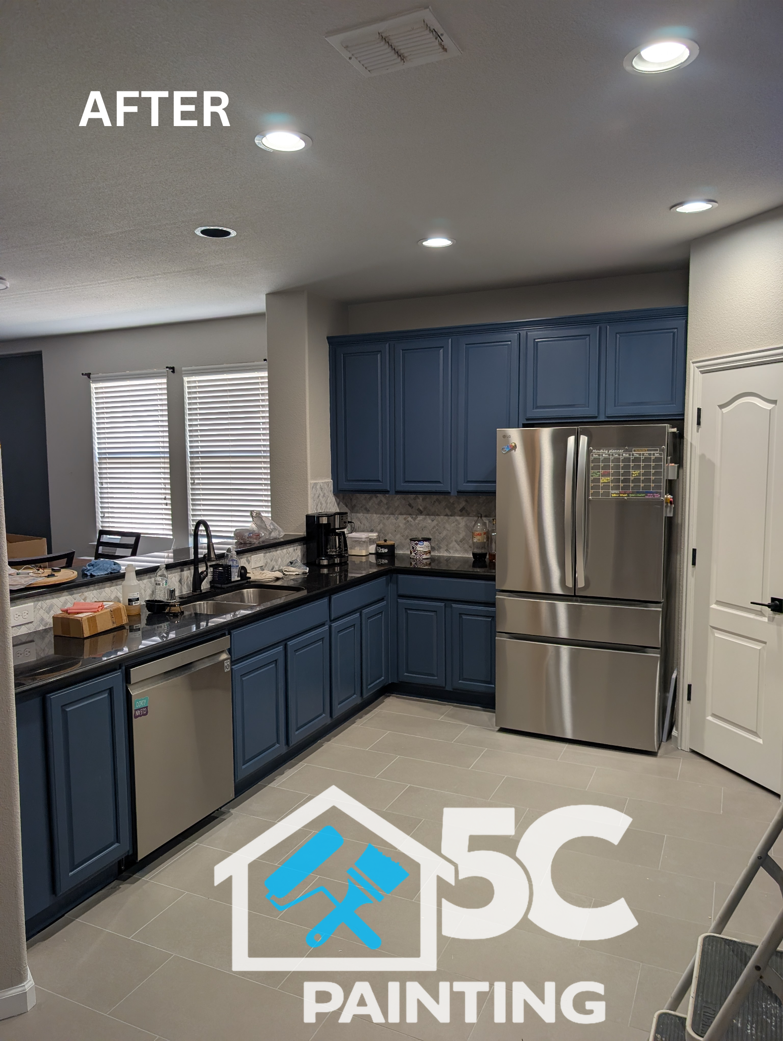 A full view of the finished cabinet painting project in Lake Dallas — every door, drawer, and panel repainted in a rich slate blue for a modern, cohesive look throughout the kitchen.