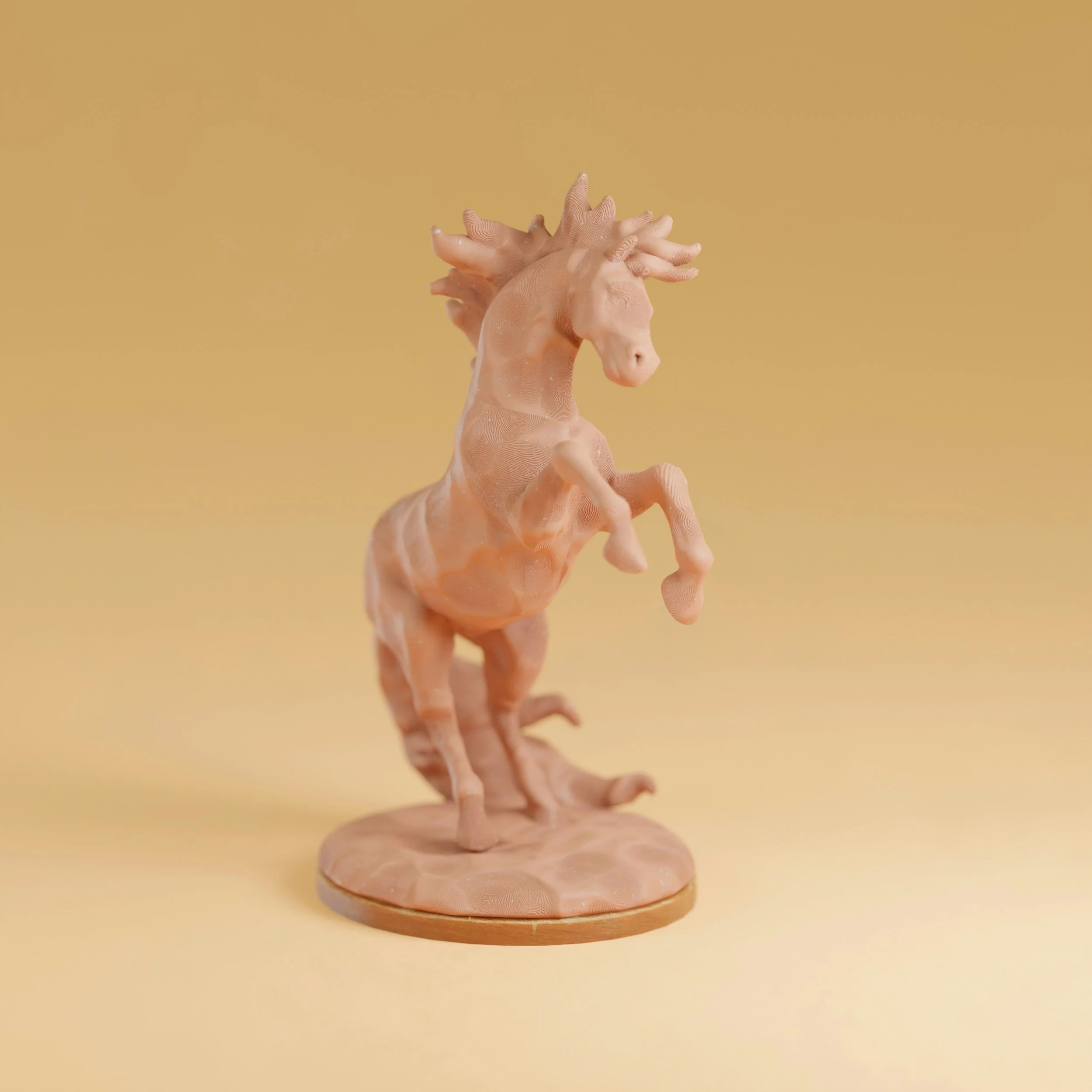 A pink figurine of a rearing unicorn with a textured surface, set on a round wooden base against a yellow background.
