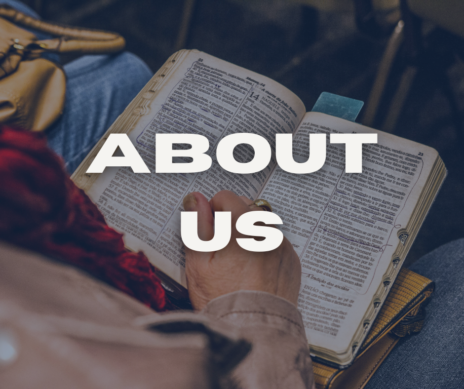 A person reading the Bible with a yellow book underneath, sitting on a chair or bench.