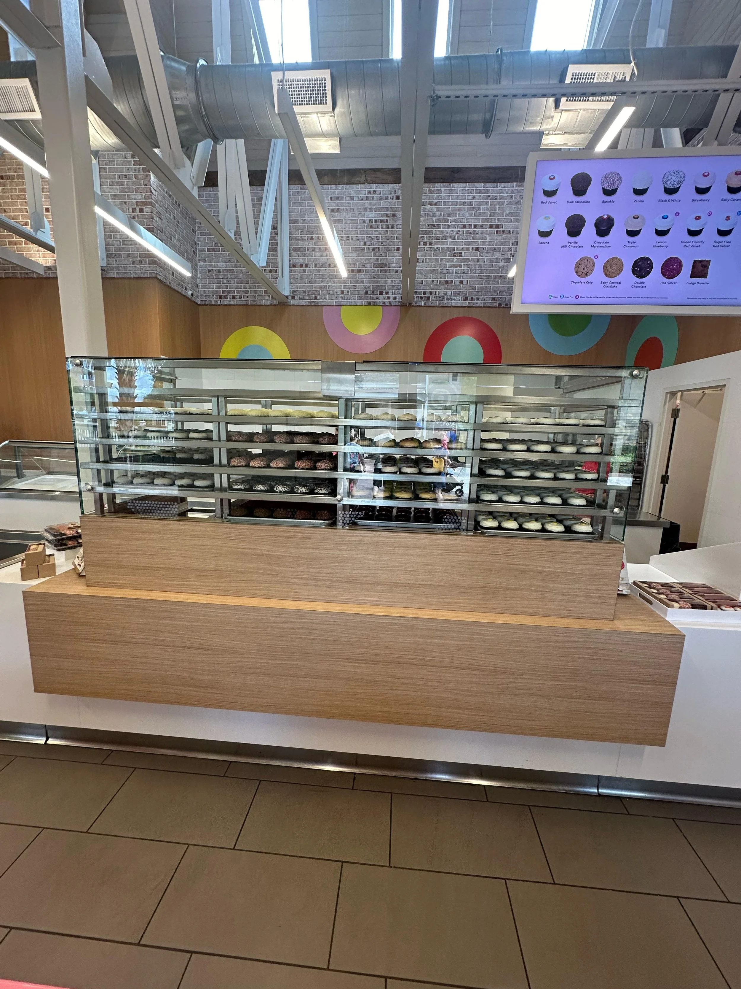Fabrication and installation of custom laminate front storage and millwork units for Sparklis Cupcake at Disney Springs. Metric Smart Solutions LLC built and installed all laminated fronts and storage components on top of a metal structure GC provid