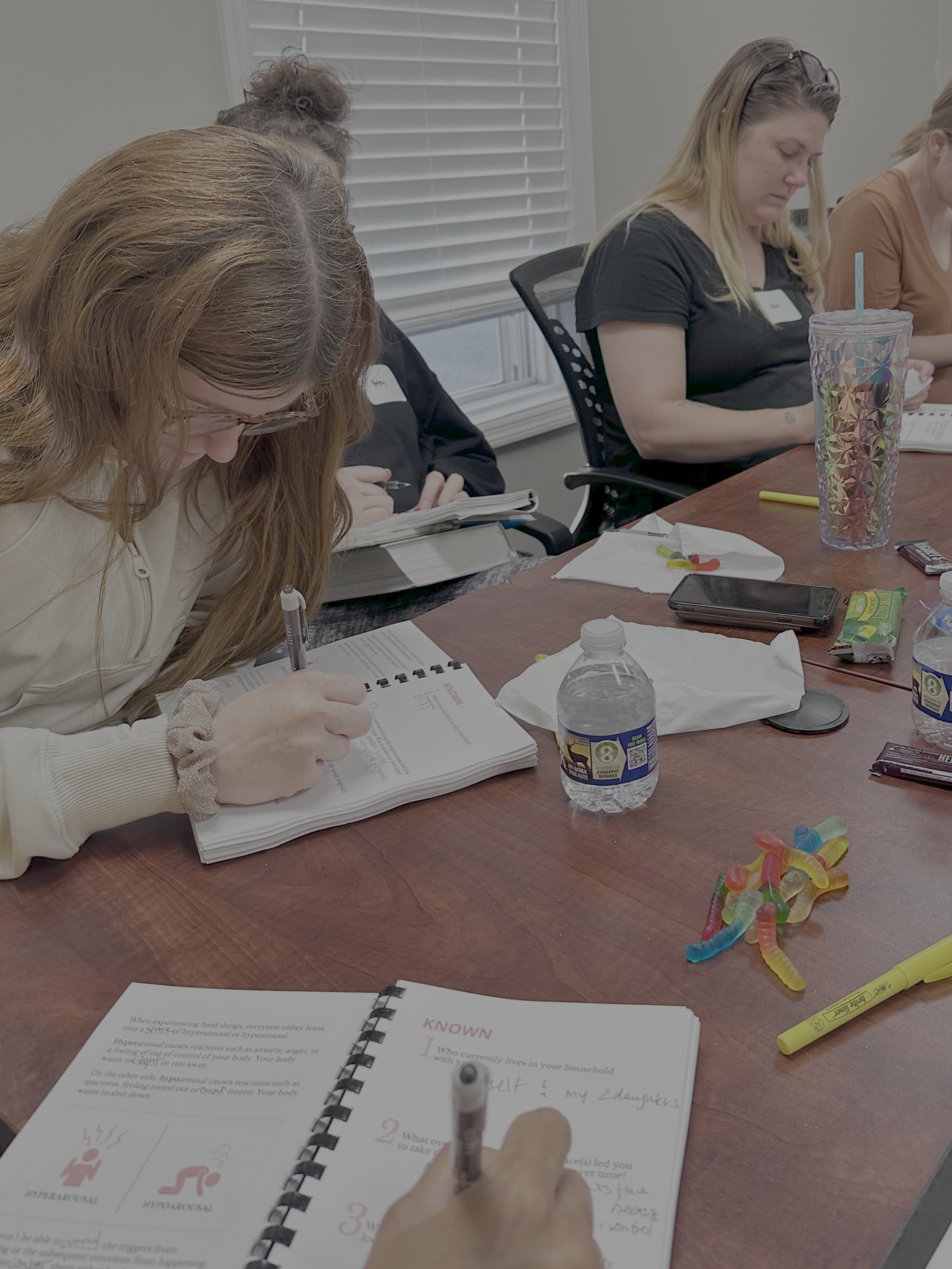 A class of women thinking hard about the materials
