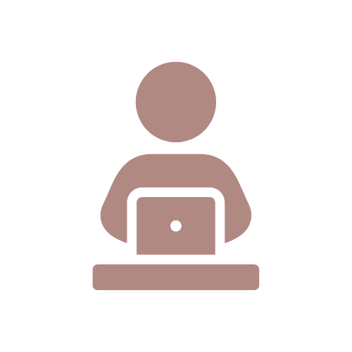 Icon of a person sitting at a desk with a laptop