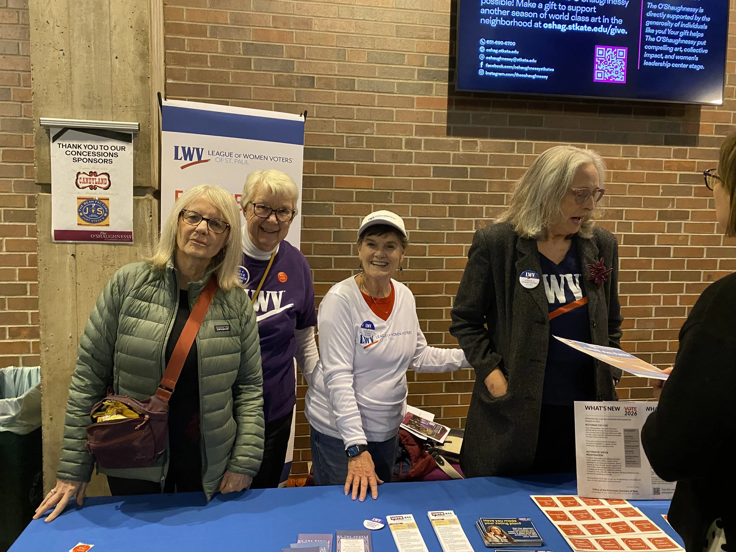 LWVSP members pose at public table at Goodman lecture