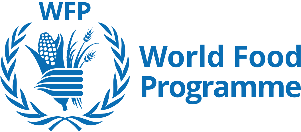 Logo of the World Food Programme featuring a hand holding wheat and other crops, surrounded by a blue laurel wreath, with the text 'WFP World Food Programme' to the right.