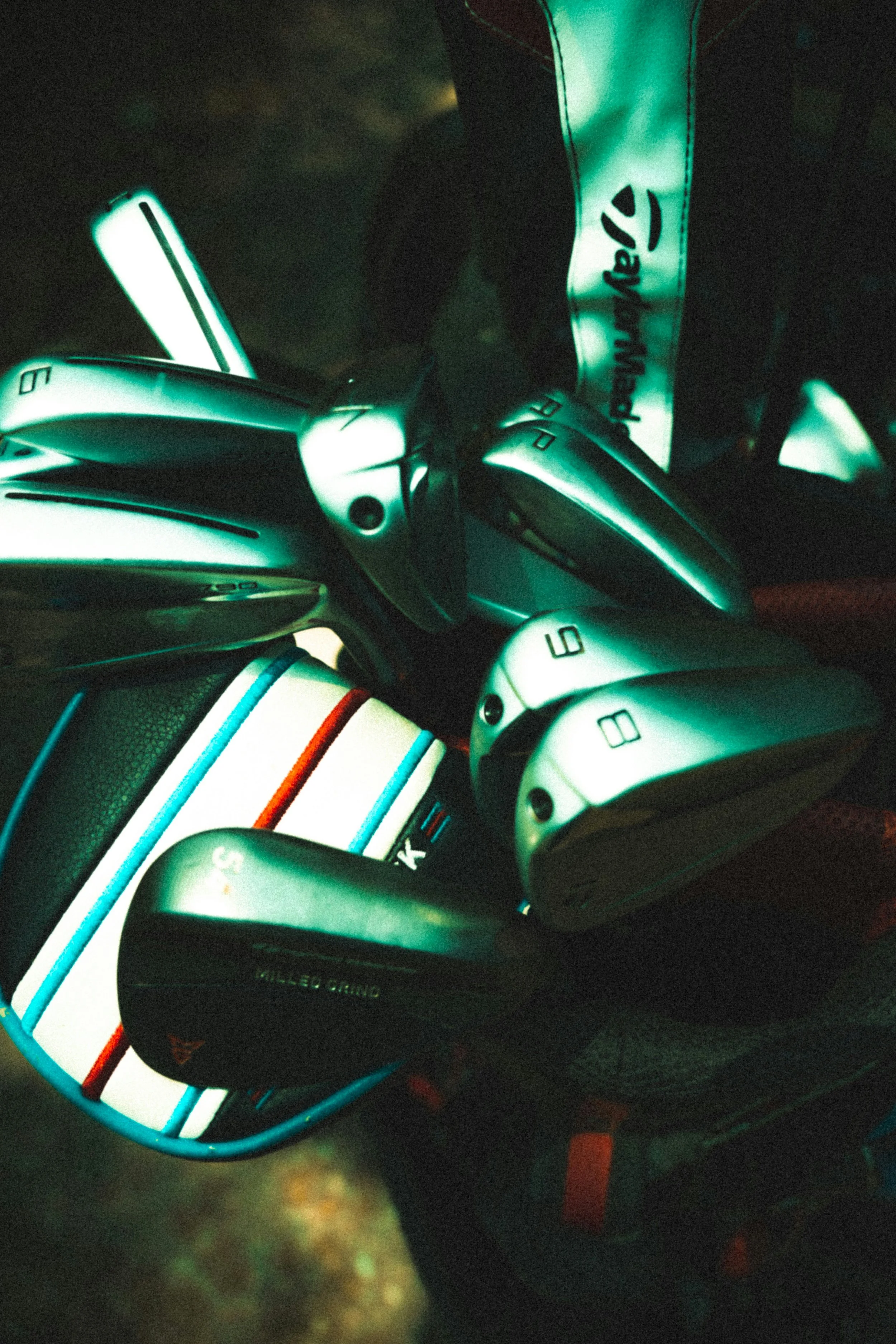 Golf clubs and a golf bag in a bag holder.