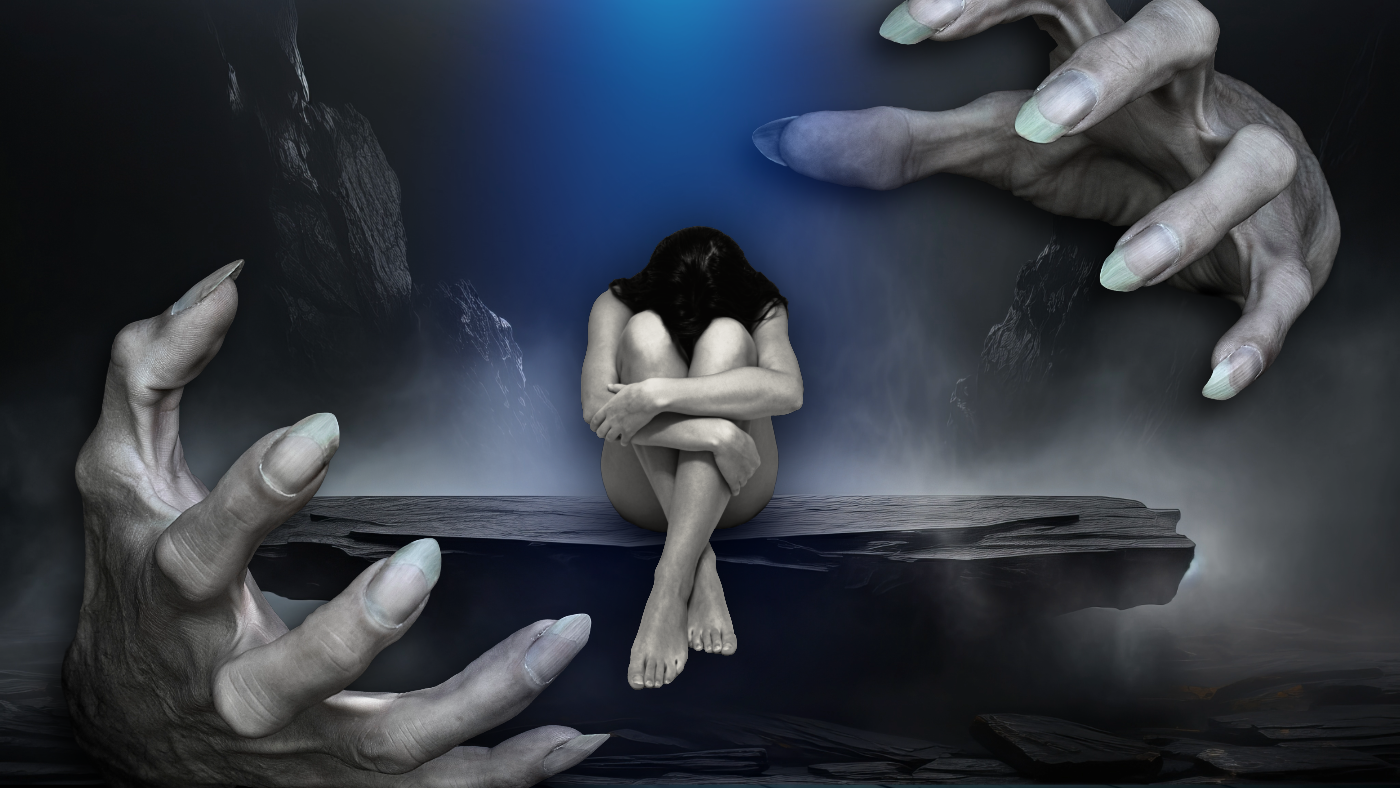 A woman sitting with knees drawn up, hugging her legs and head bowed, on a floating wooden platform surrounded by large hands reaching towards her in a dark, foggy, mountainous landscape.